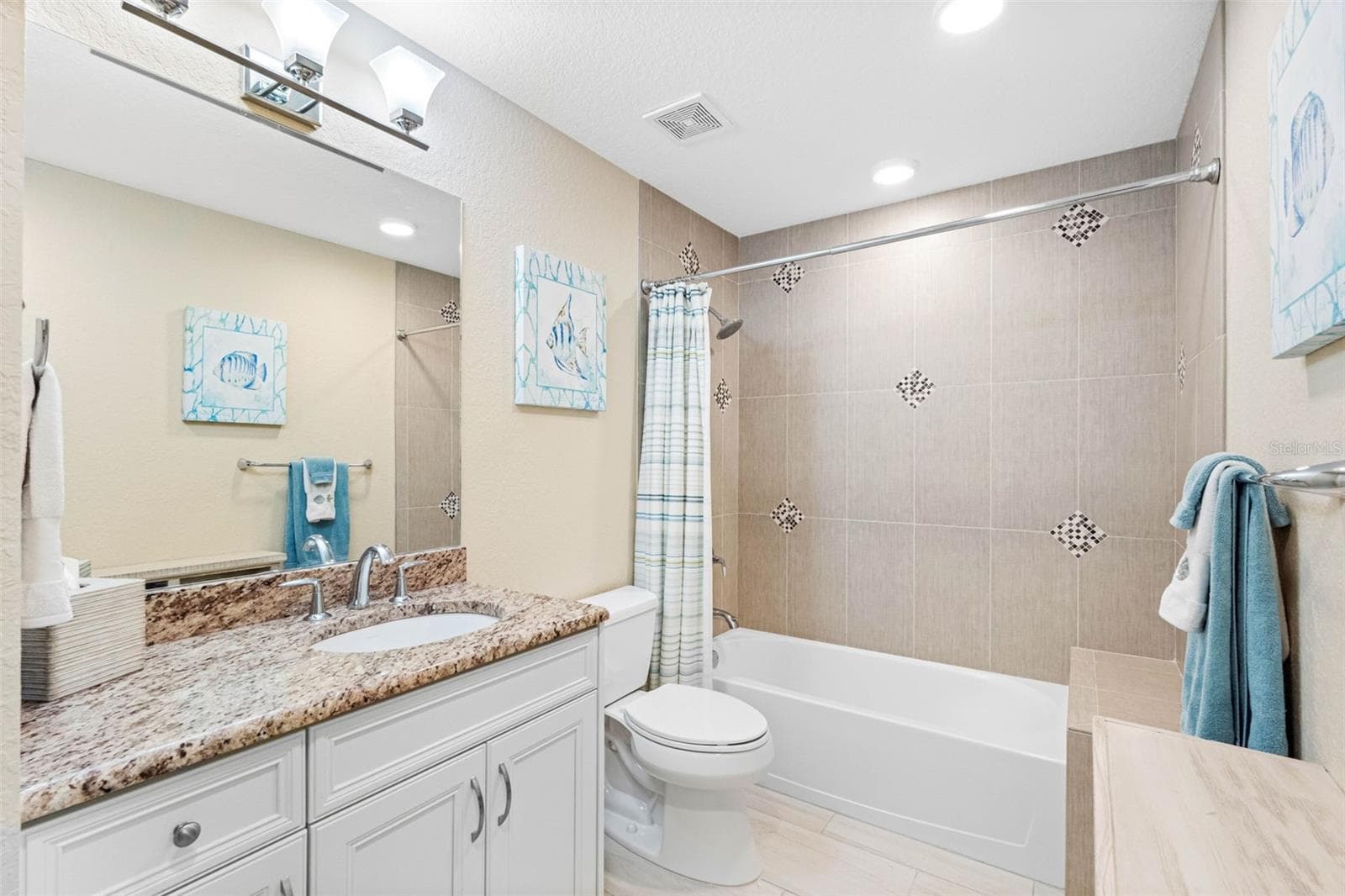 ... GUEST BATHROOM - 11.9 X 6.1... Tub With Shower - Built in Tiled Bench Seat. Guest Bathroom can be Accessed from Hallway and or Guest Bedroom. - 19519 GULF BLVD #202, INDIAN SHORES