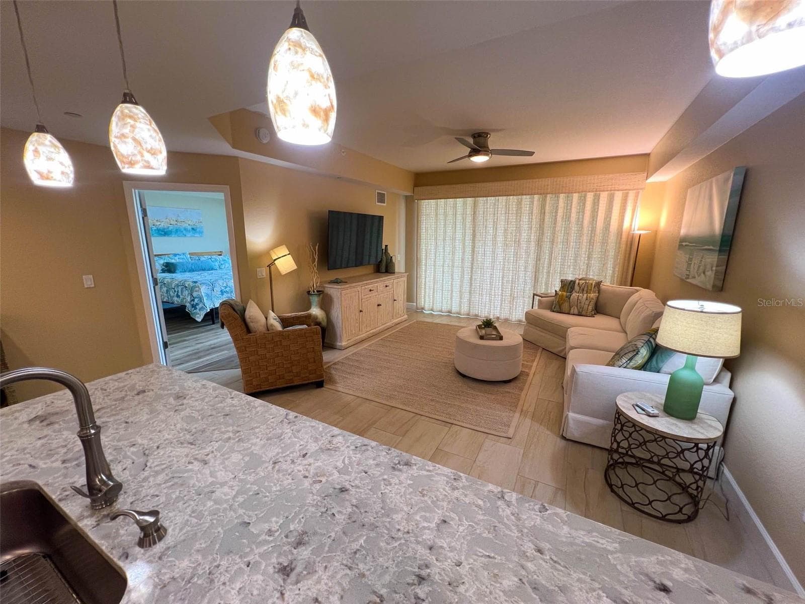 ... LIVING ROOM : 18 x 14.6 .. Two Way Custom ' Floor to Ceiling ' Light Filtering Woven Wood Drapes On Balcony Sliders. - 19519 GULF BLVD #202, INDIAN SHORES