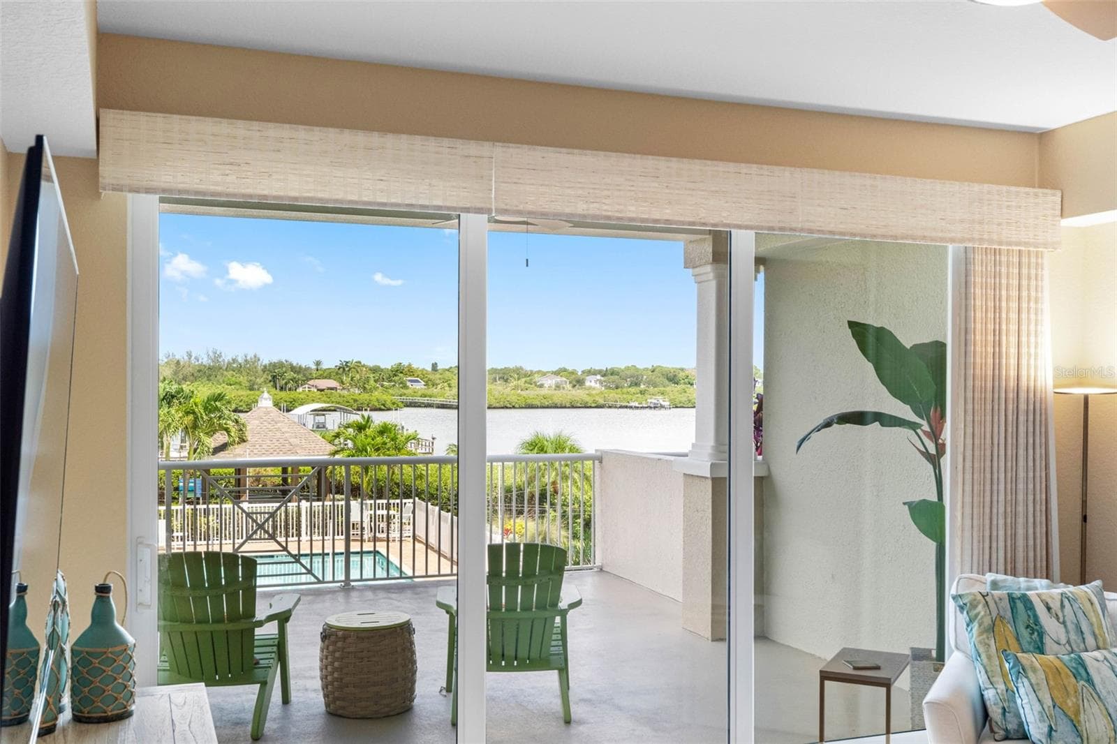... LIVING ROOM VIEW. Triple High Impact Sliders Can Recess to an Eight Foot Opening.. Perfect for Entertaining . - 19519 GULF BLVD #202, INDIAN SHORES