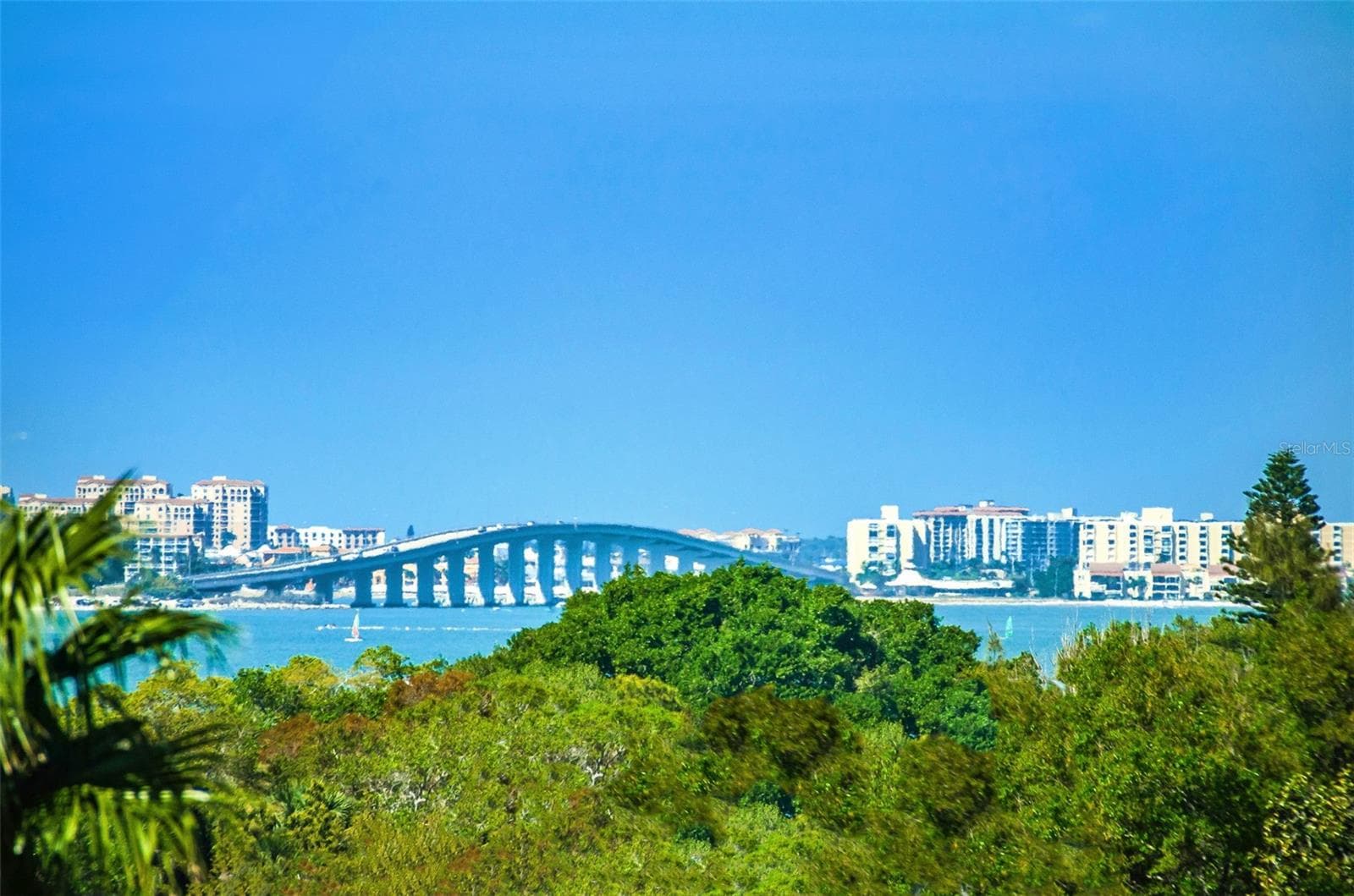 Upon entering into the Great Room of this Penthouse...your view to the North of the Sand Key Bridge from your 41 feet of windows. - 139 BLUFF VIEW DR #407, BELLEAIR BLUFFS