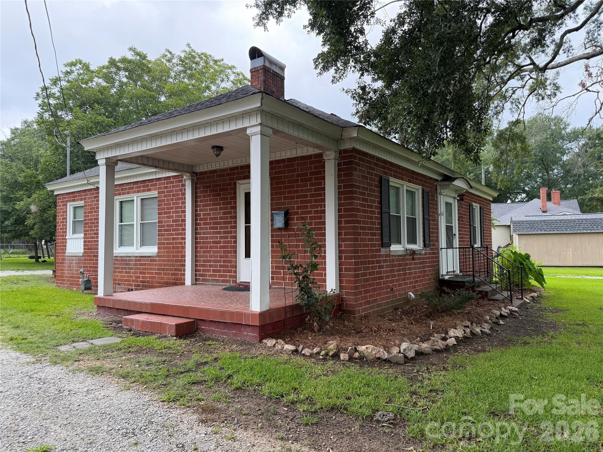 Charming side porch—perfect for welcoming guests or conveniently unloading groceries. - 612 Ballard Street, Chester