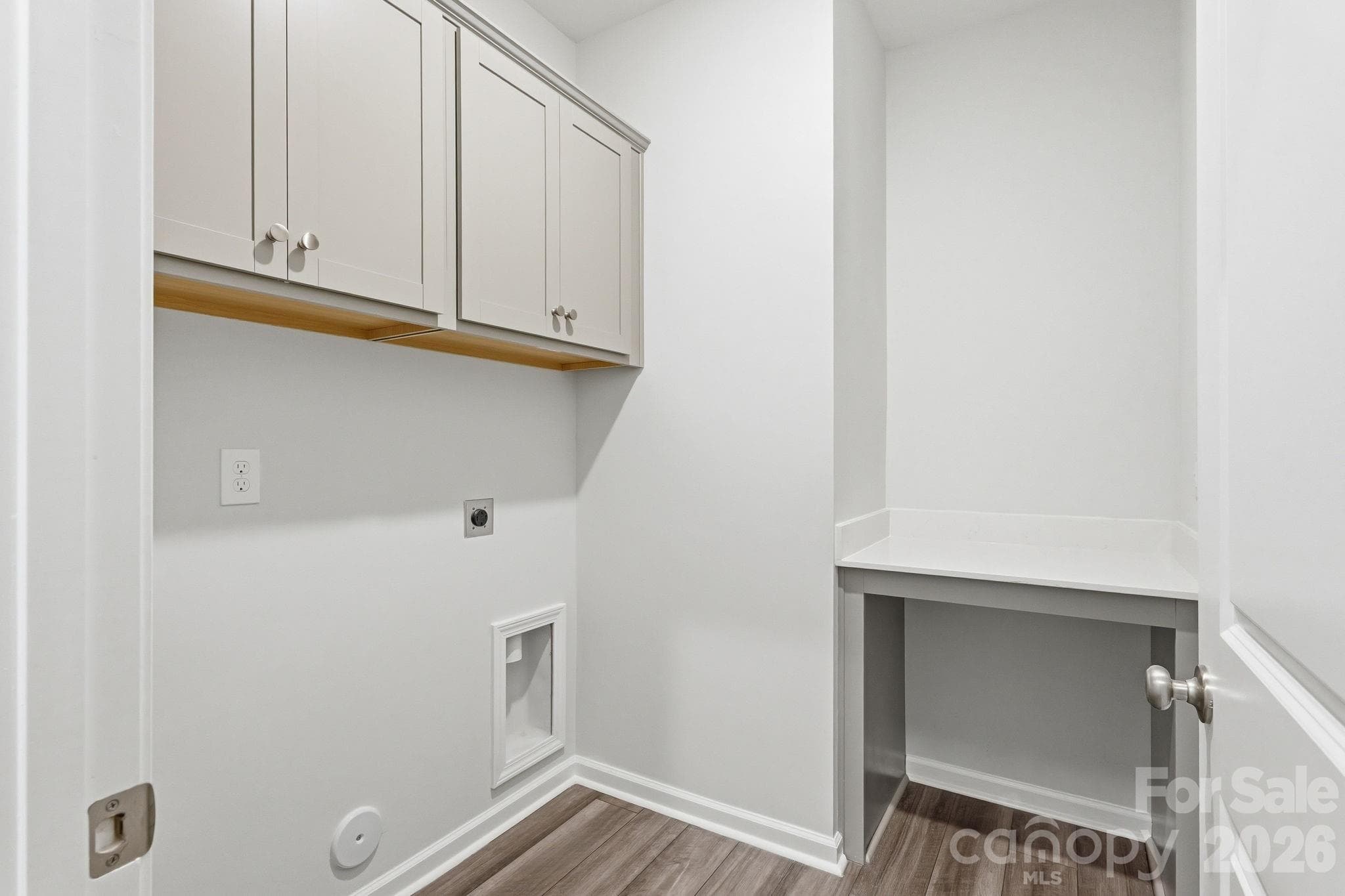 Laundry area with cabinets and folding table - Shelby