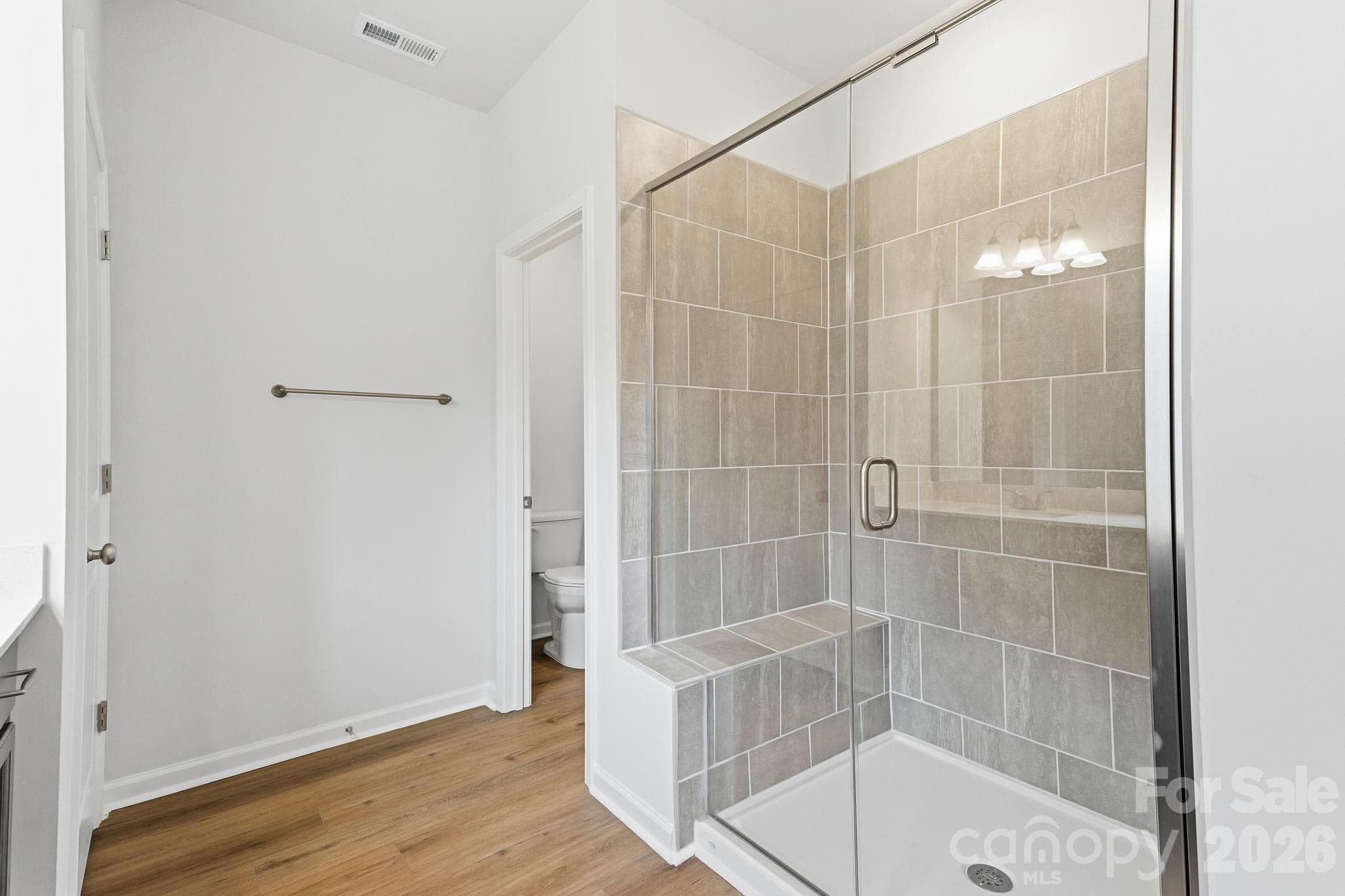Primary tiled shower with seat - 204 Rodeo Drive, Shelby