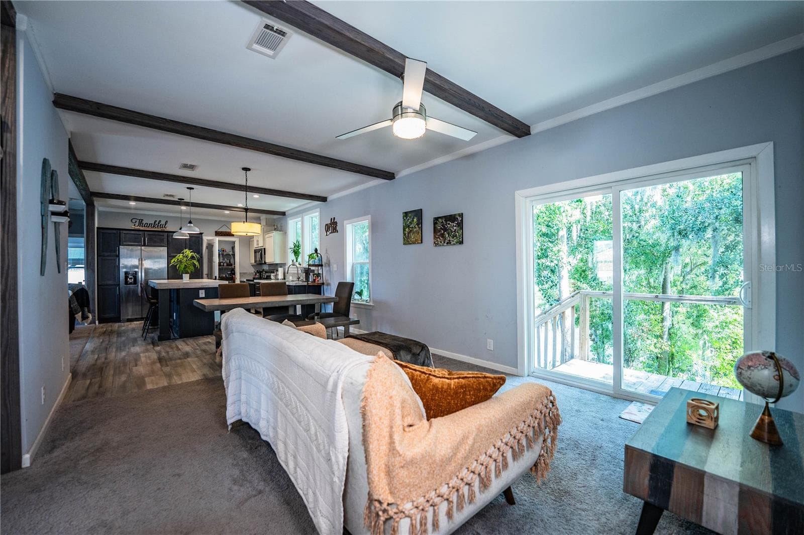 Family Room overlooking lake - 950 LAKE COVE TRL, LAKELAND