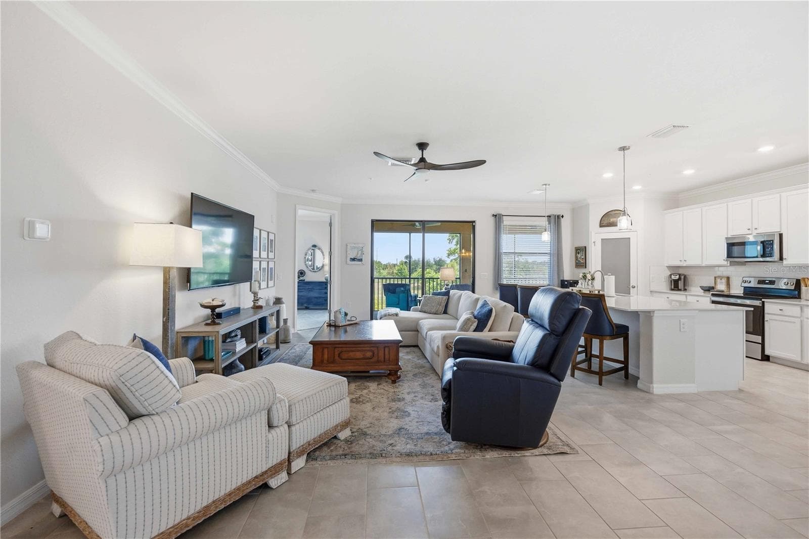 More than 2200 sq ft of fabulous living.  Complete with all appliances, and easy living overlooking a beautiful lake - this home comes with two golf memberships to the newly designed Fry Straka course . - 10821 TARFLOWER DR #202, VENICE