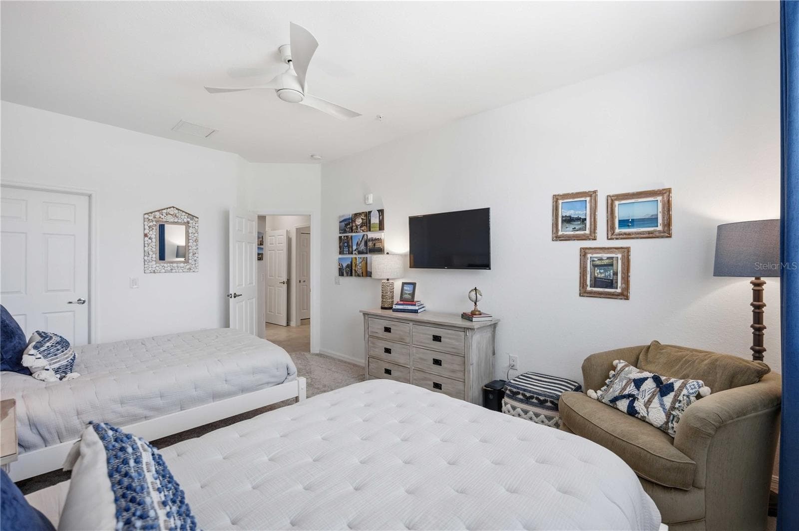 Guest room 3 has two full beds for guests. There is ample room to move around. - 10821 TARFLOWER DR #202, VENICE