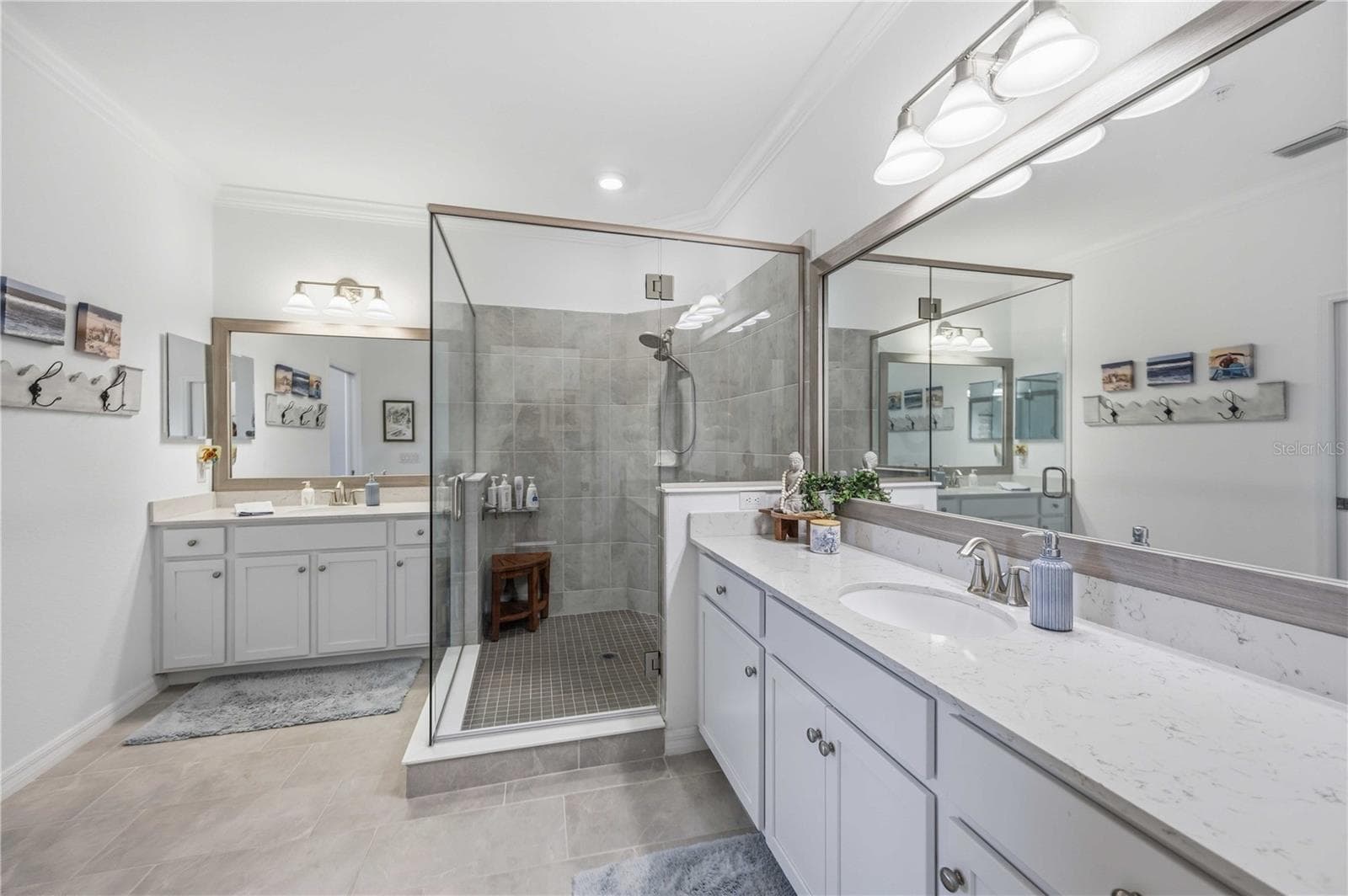 The ensuite bath has a huge shower and dual vanities /sinks and a private water closet. - 10821 TARFLOWER DR #202, VENICE