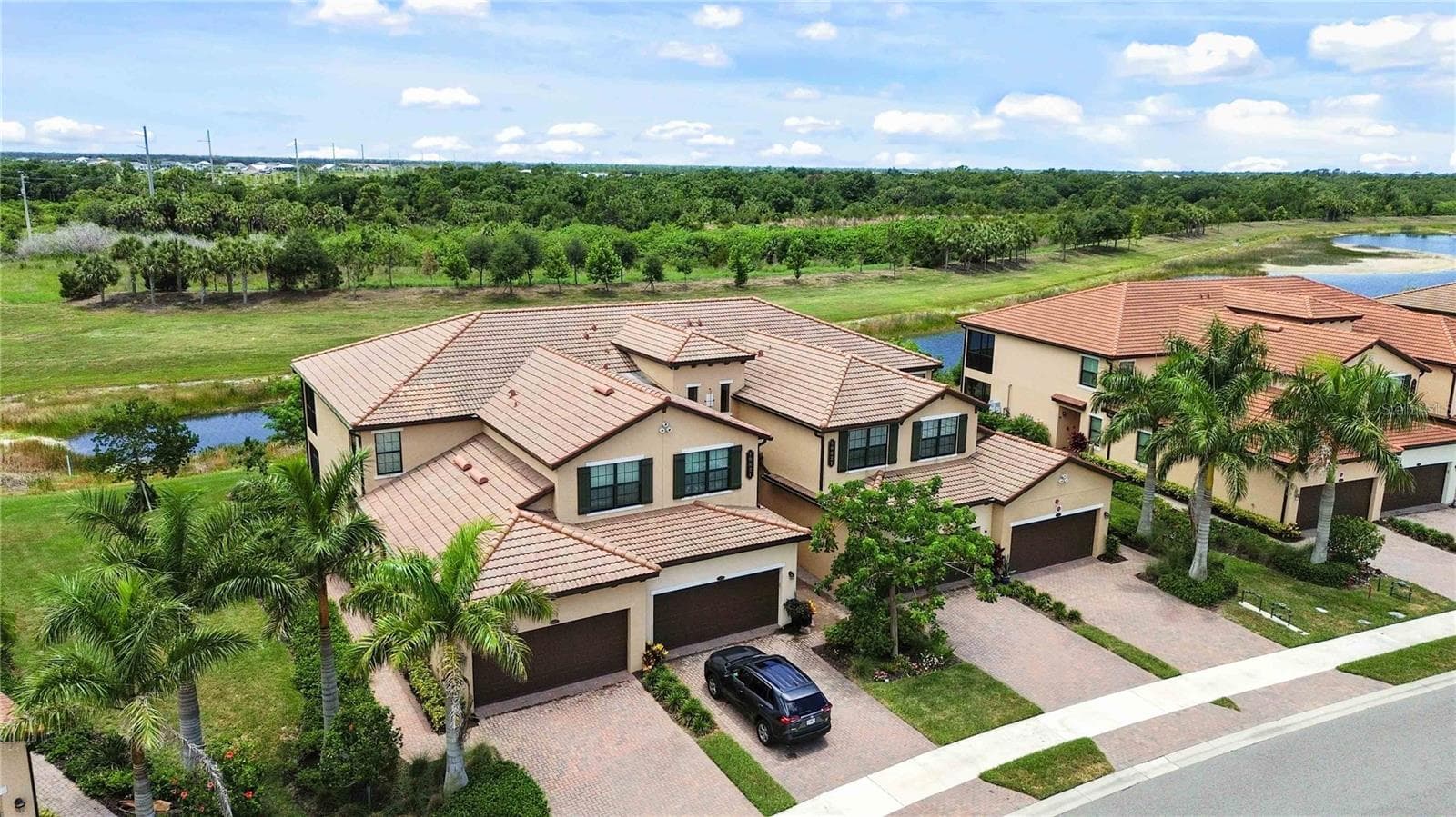 Aerial of the condo from the front of the building. - 10821 TARFLOWER DR #202, VENICE