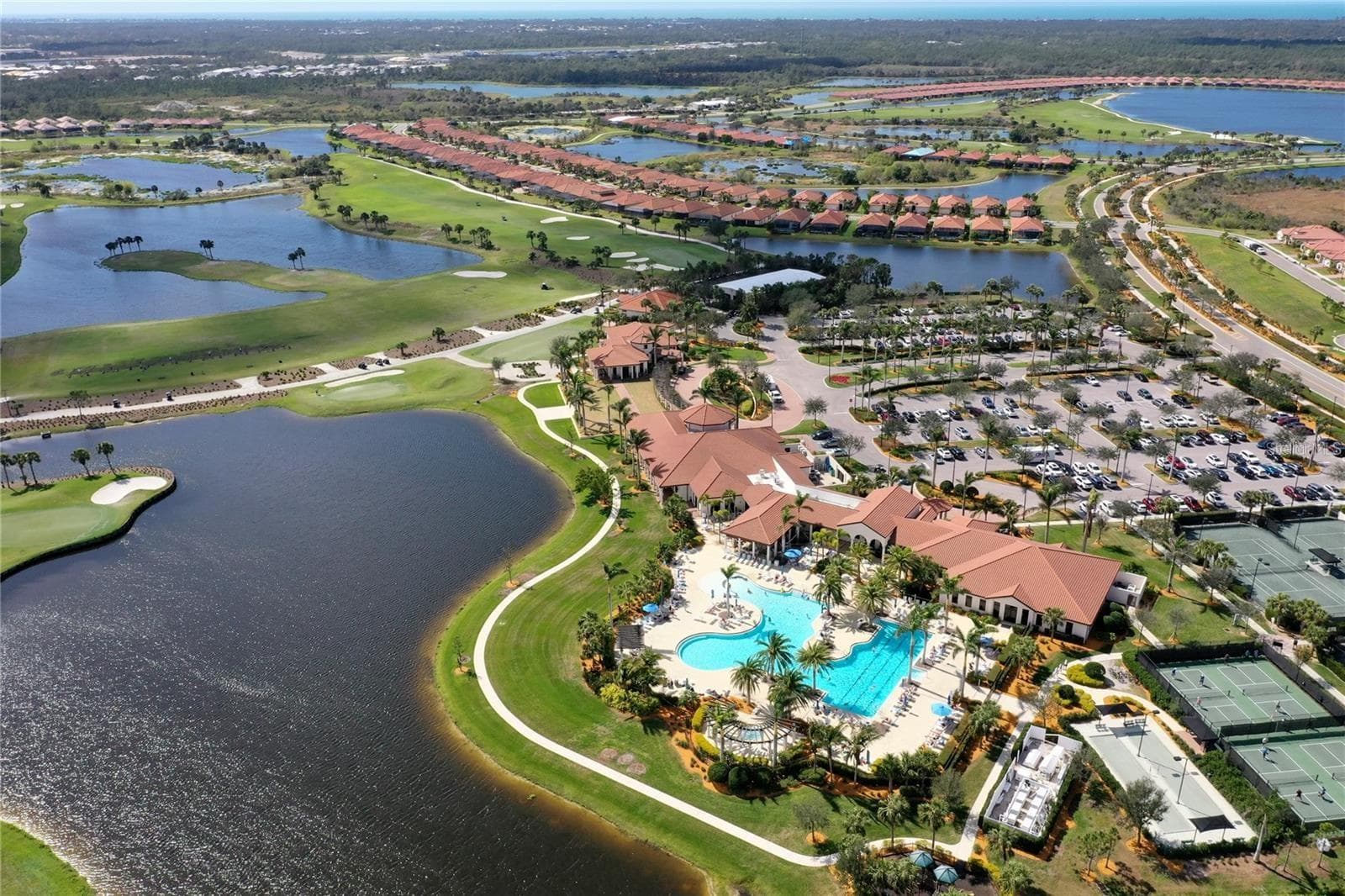 The golf course from the air and the amenity center - 10821 TARFLOWER DR #202, VENICE