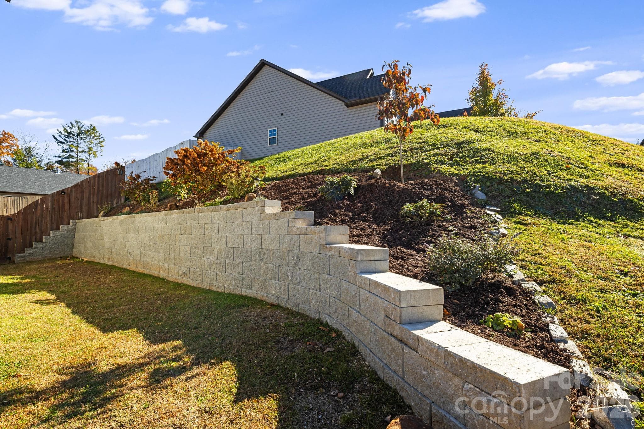 Brand new $15K Stone Terrace added in 2024 - Easy step access for gardening. New Dogwood Tree added - The NC State Tree!! - Weaverville