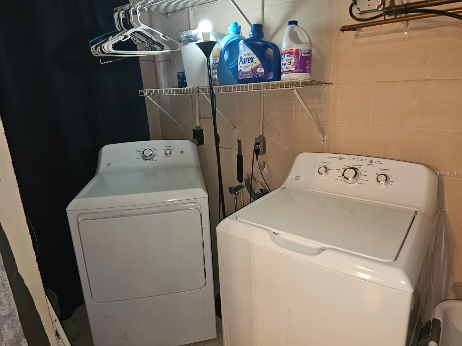 Laundry hookups for washer and dryer with shelving - 5203 SE 114TH ST, BELLEVIEW