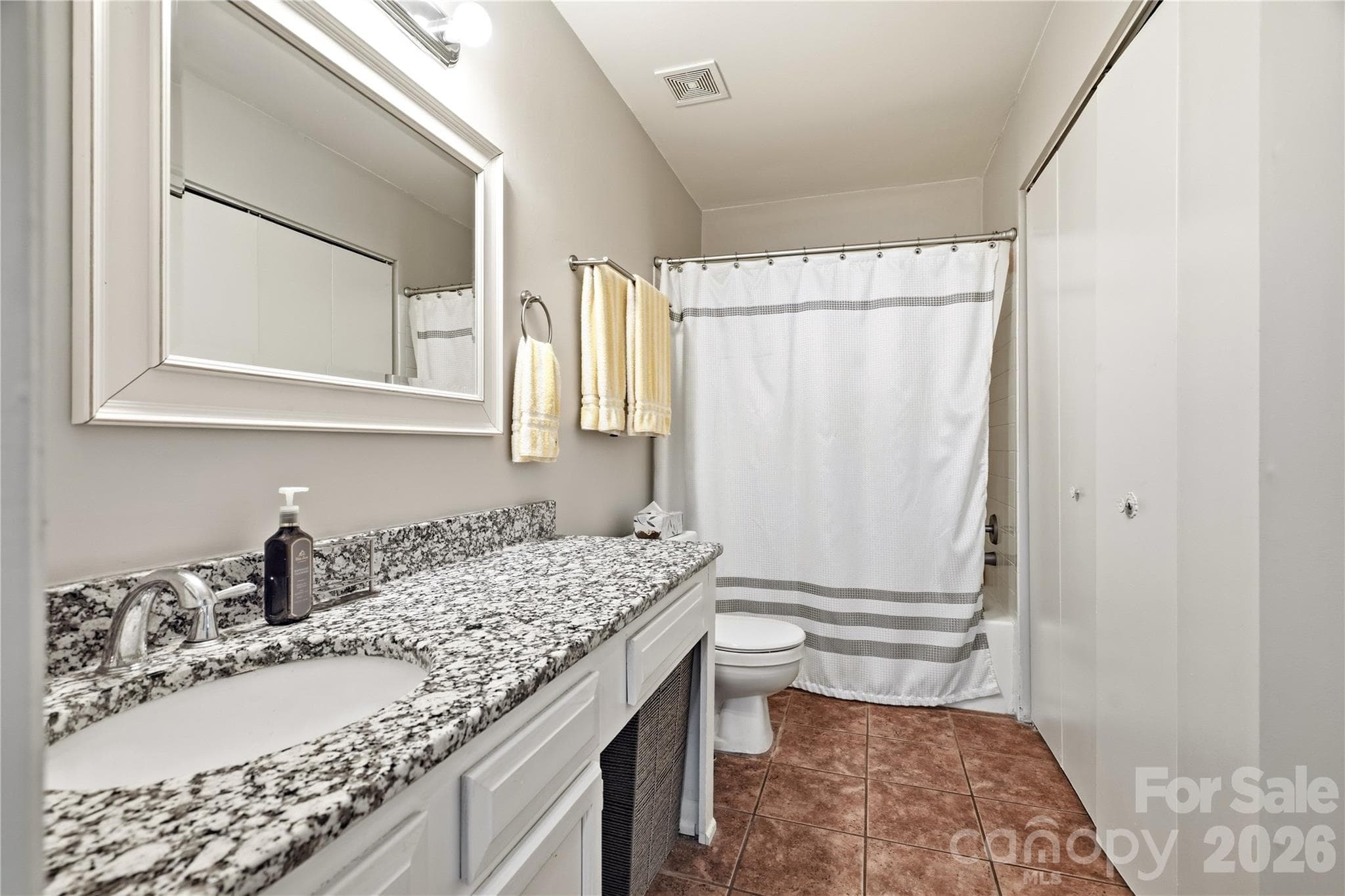 Tiled bathroom floor with spacious countertop - 6355 Windsor Gate Lane, Charlotte