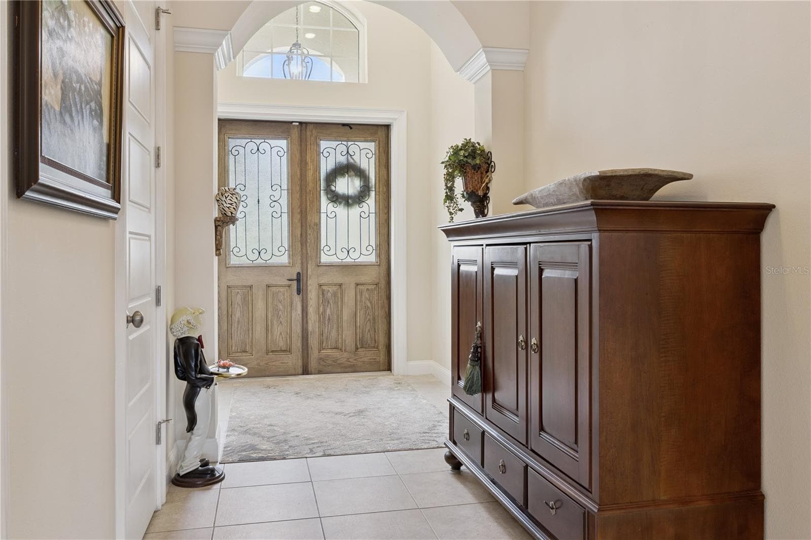 Foyer with arch over wide entry way - 9219 SAN JOSE BLVD, HOWEY IN THE HILLS