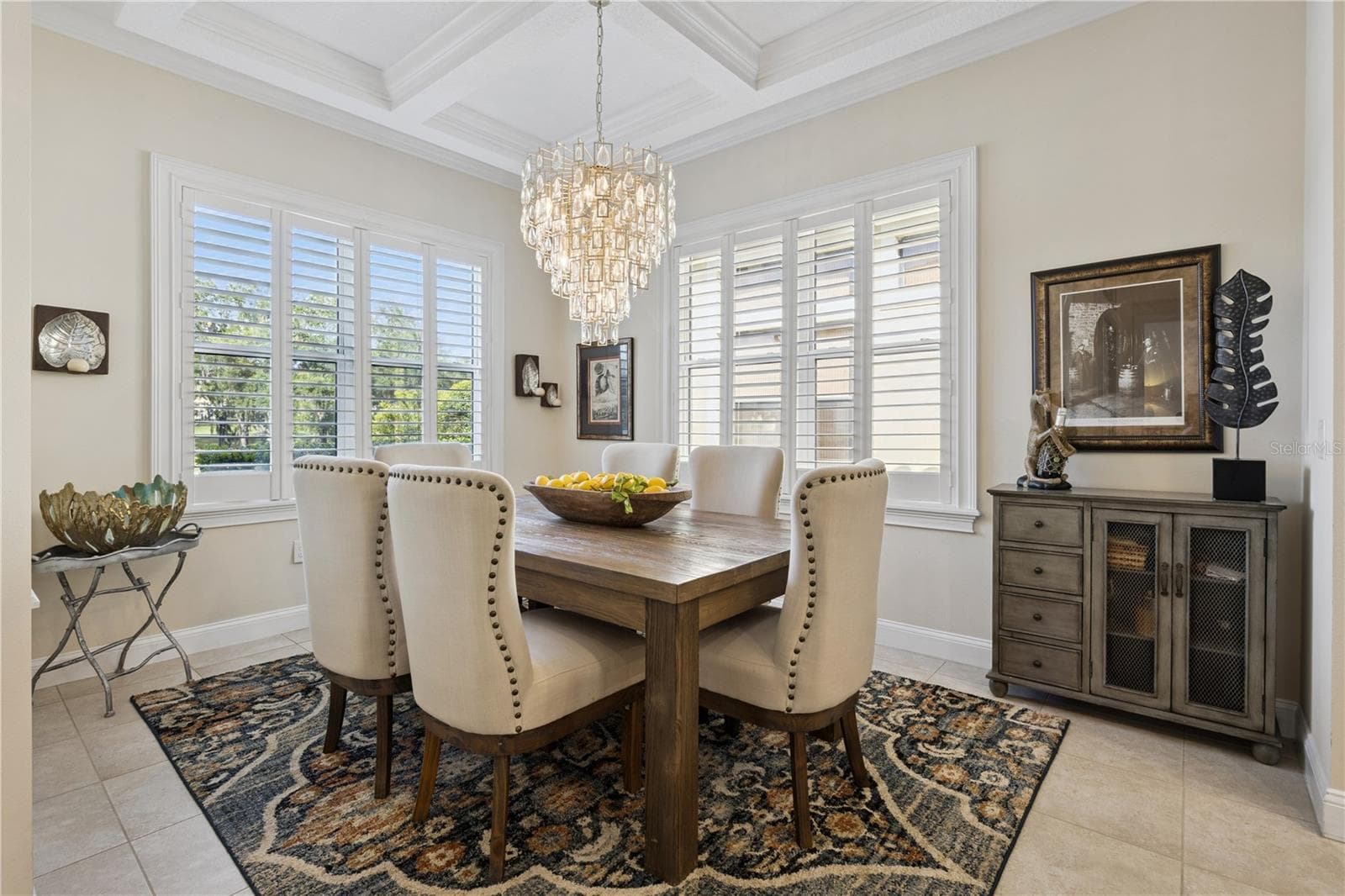 Stunning Dining room with designer light fixture and tray ceiling. - 9219 SAN JOSE BLVD, HOWEY IN THE HILLS