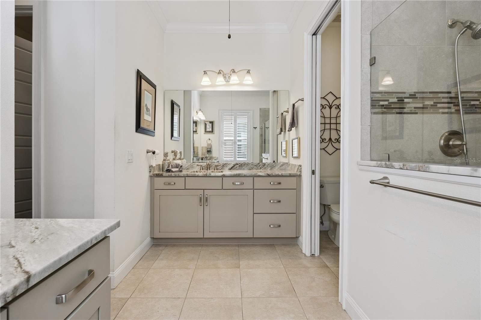 Stunning Master Bath with His & Her vanities plus Shower. - 9219 SAN JOSE BLVD, HOWEY IN THE HILLS