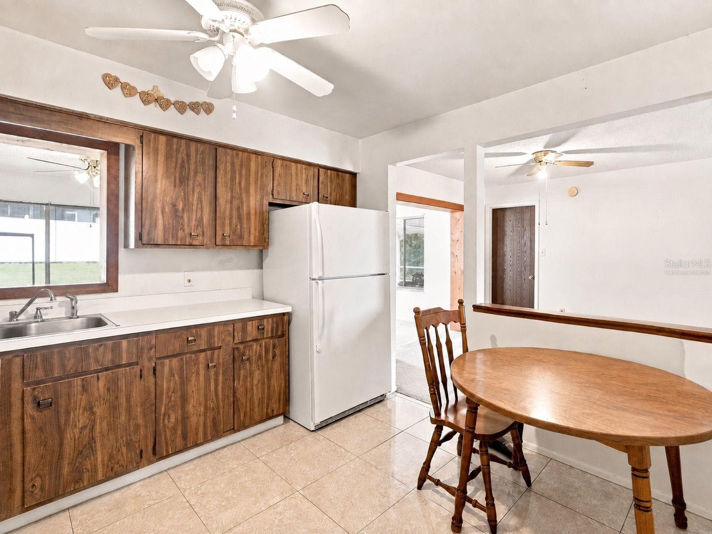 Virtually staged kitchen - 1418 CATALINA BLVD, DELTONA