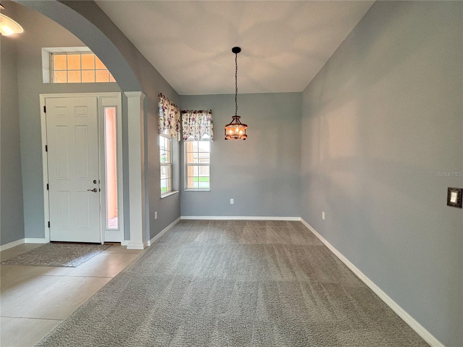 Front Door and Formal Dining Area - 1124 SAWGRASS DR, WINTER HAVEN