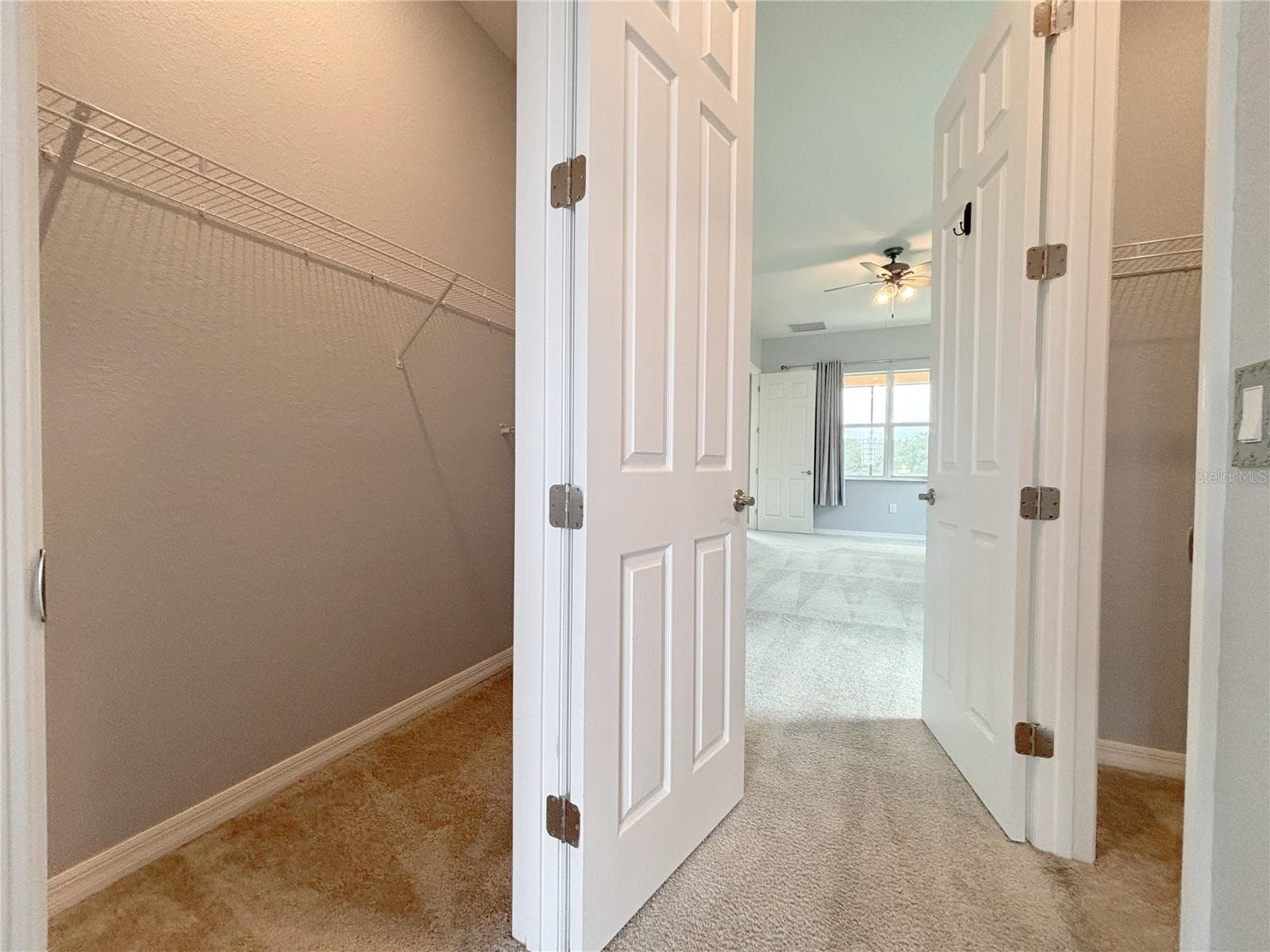 His/Her Walk In Closets - 1124 SAWGRASS DR, WINTER HAVEN