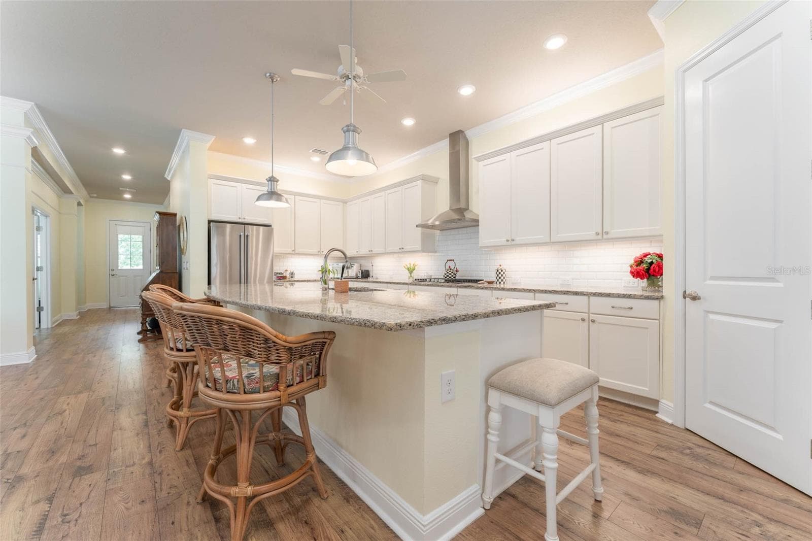 Expansive Kitchen with Island Seating, SS Appliances, Gas Cooktop, Subway Tile Backsplash, Under Cabinet Lighting, Walk in Pantry, Abundant  Softclose Cabinetry - 14008 SWALLOW HILL DR, LITHIA