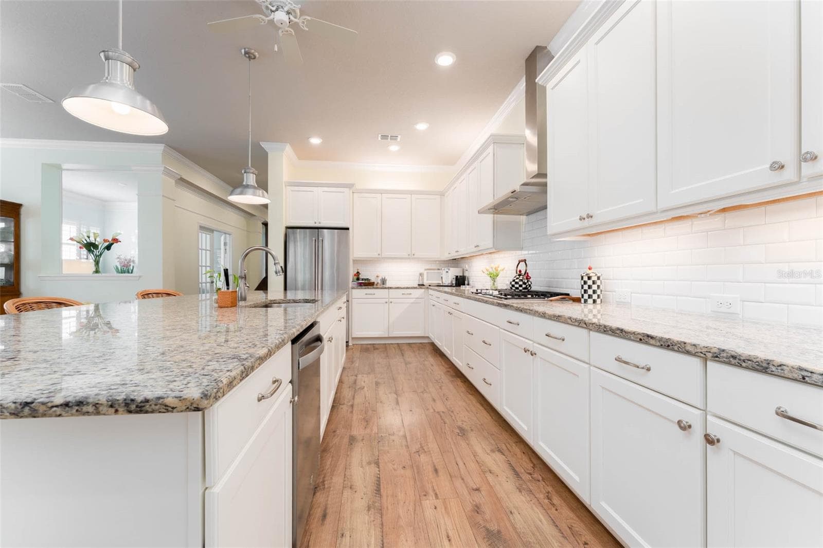 Expansive Kitchen with Island Seating, SS Appliances, Gas Cooktop, Subway Tile Backsplash, Under Cabinet Lighting, Walk in Pantry, Abundant  Softclose Cabinetry - 14008 SWALLOW HILL DR, LITHIA