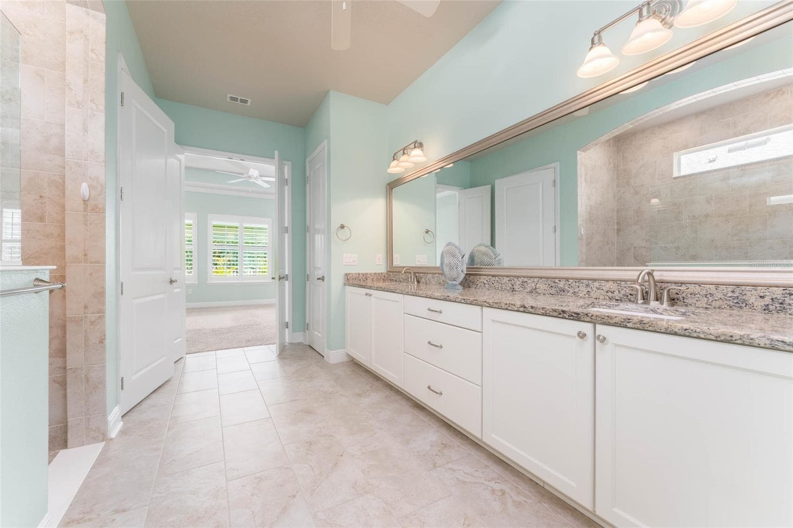 Spa like Primary Bath with Large Walk in Shower, Vanity with Dual Sinks, Granite Tops & Plentiful Cabinetry with Drawers - 14008 SWALLOW HILL DR, LITHIA