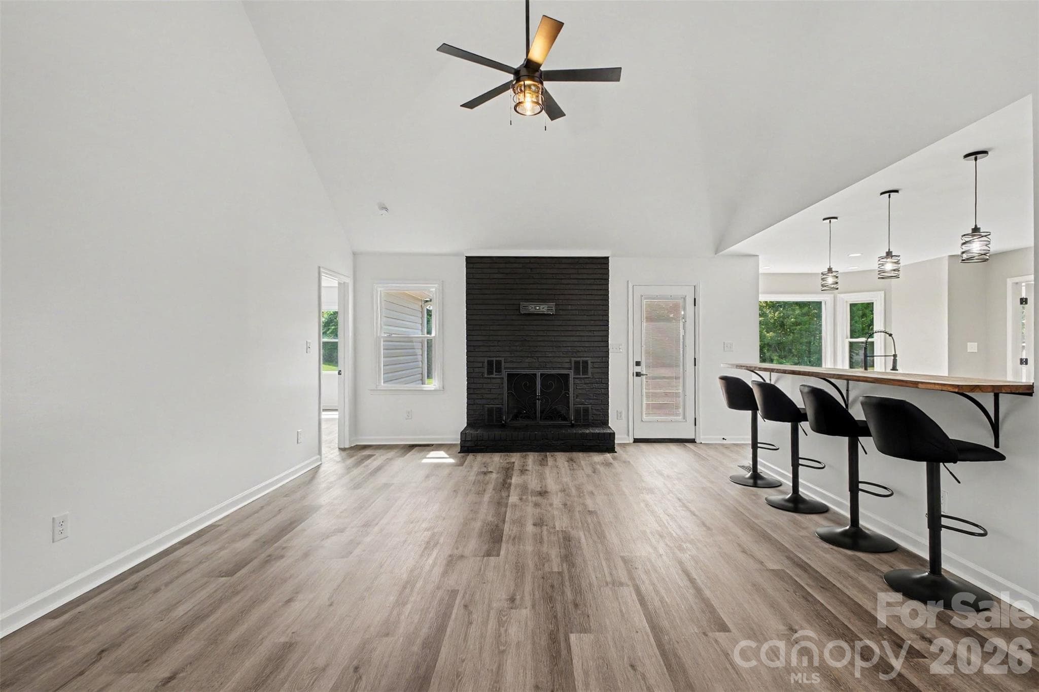 Living room with wood burning fireplace - 8379 Harvell Road, Stanfield