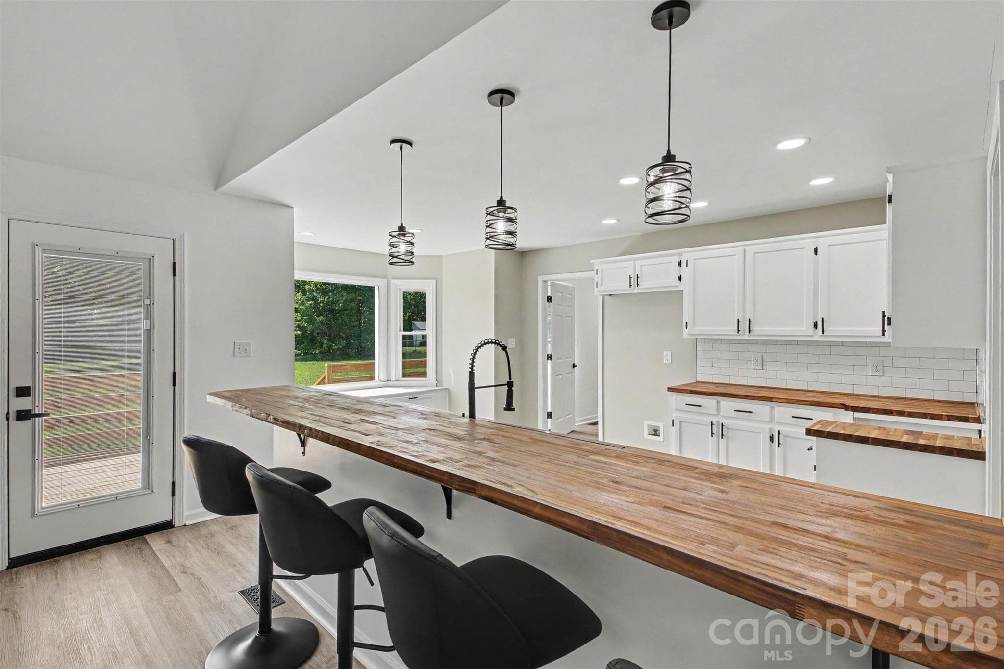 Bar and beautifully updated kitchen - 8379 Harvell Road, Stanfield