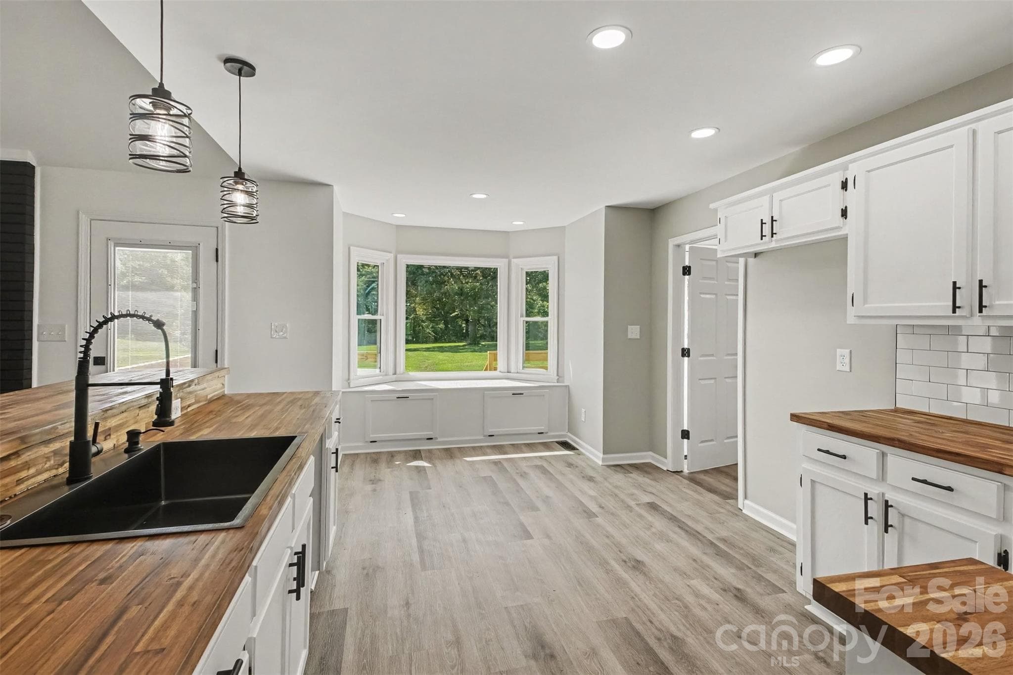 Kitchen with deep farmhouse sink - 8379 Harvell Road, Stanfield