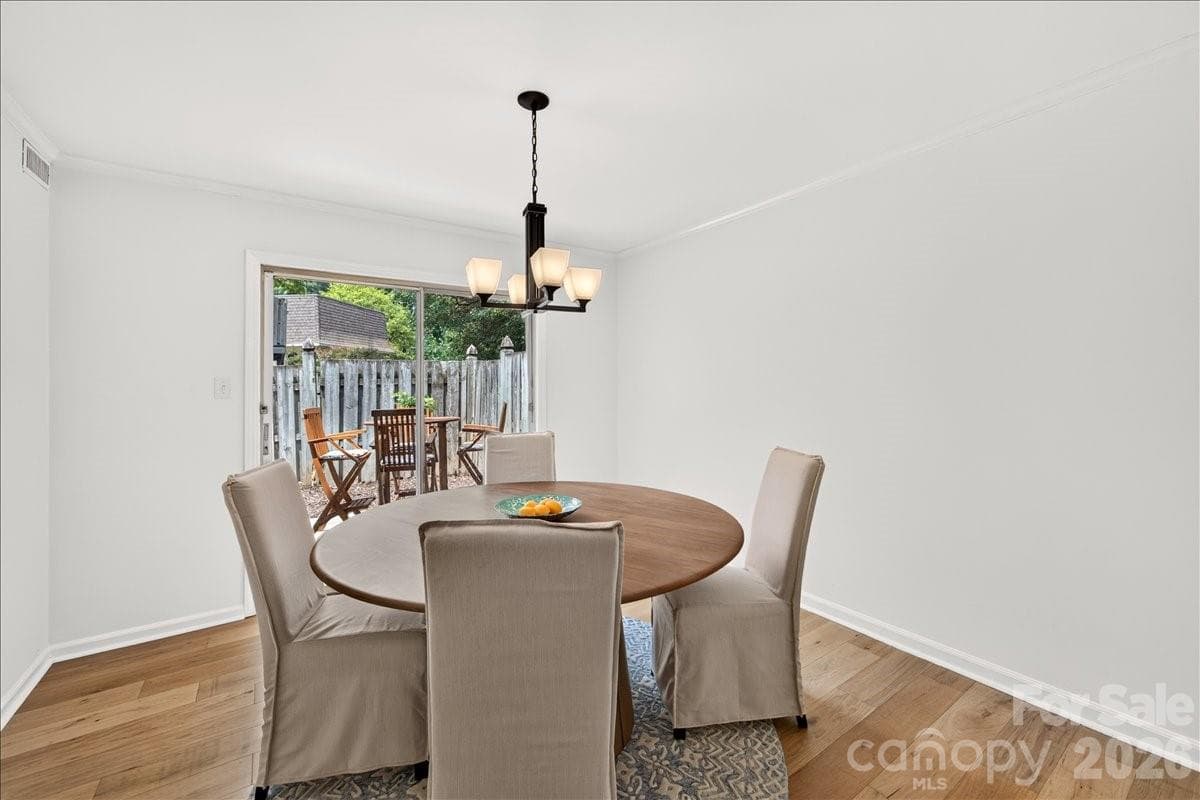 Perfectly sized dining room leads to the fenced in patio - 3500 Colony Road, Charlotte
