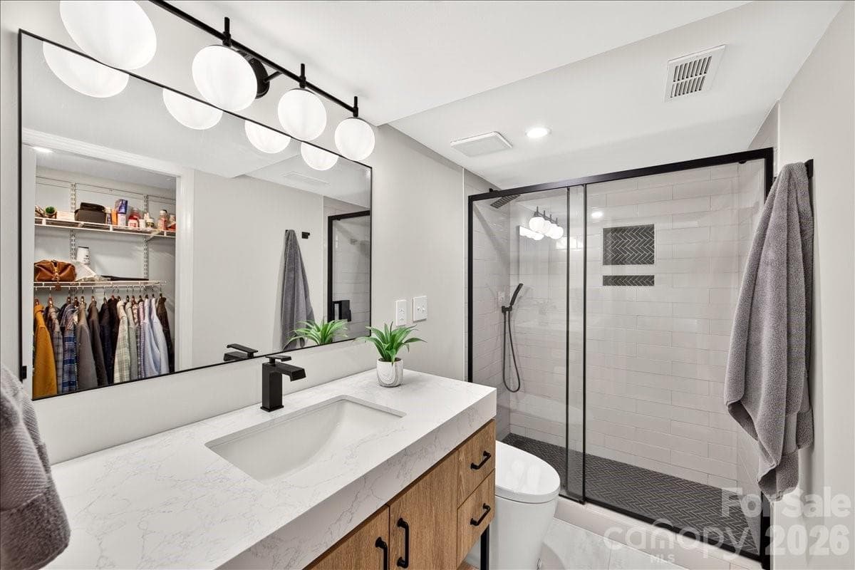 Spacious vanity, great lighting, AND thoughtful shower controls (opposite side of the shower head!) - 3500 Colony Road, Charlotte