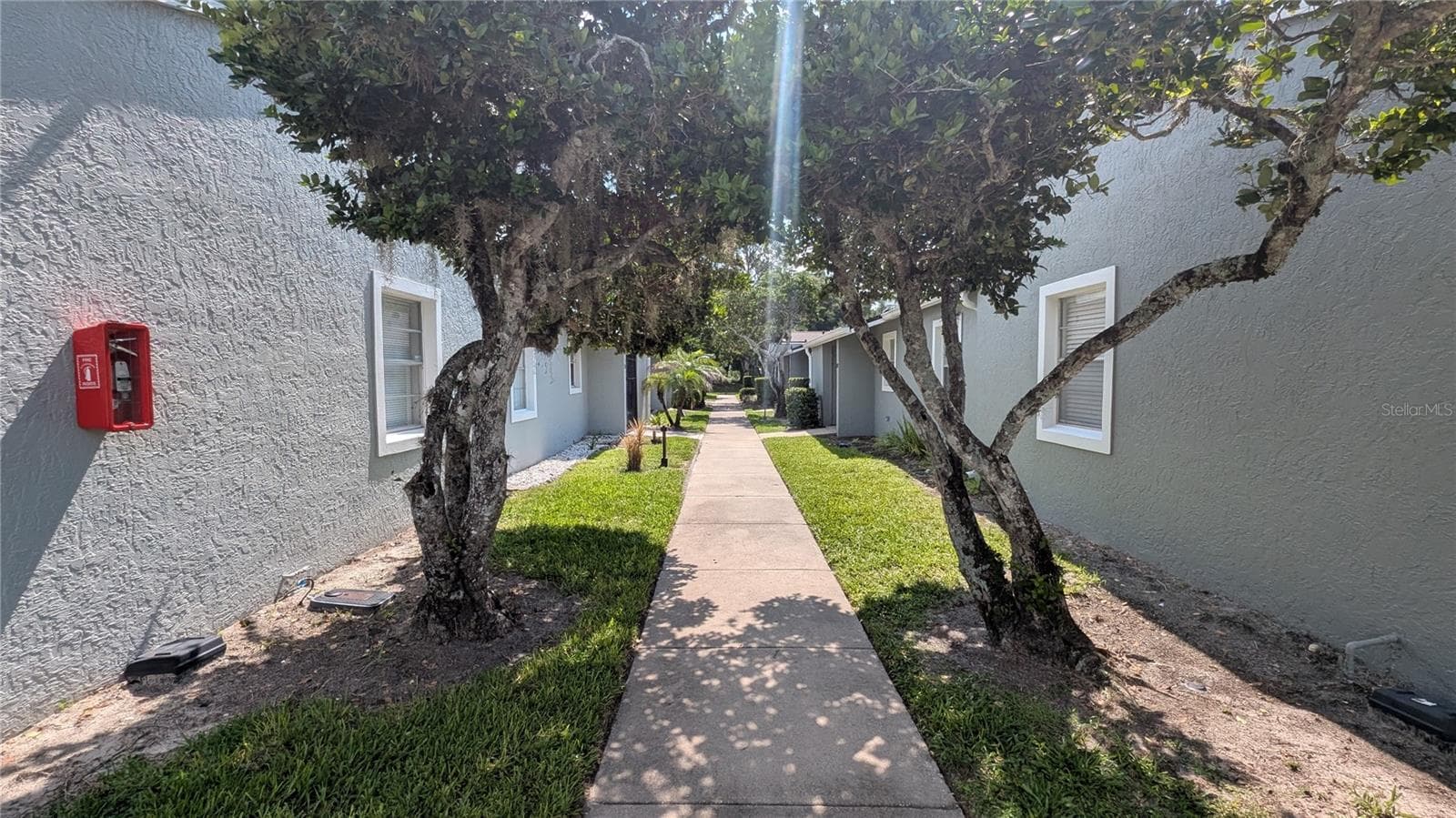 Walkway to the unit - 107 DORCHESTER SQ, LAKE MARY