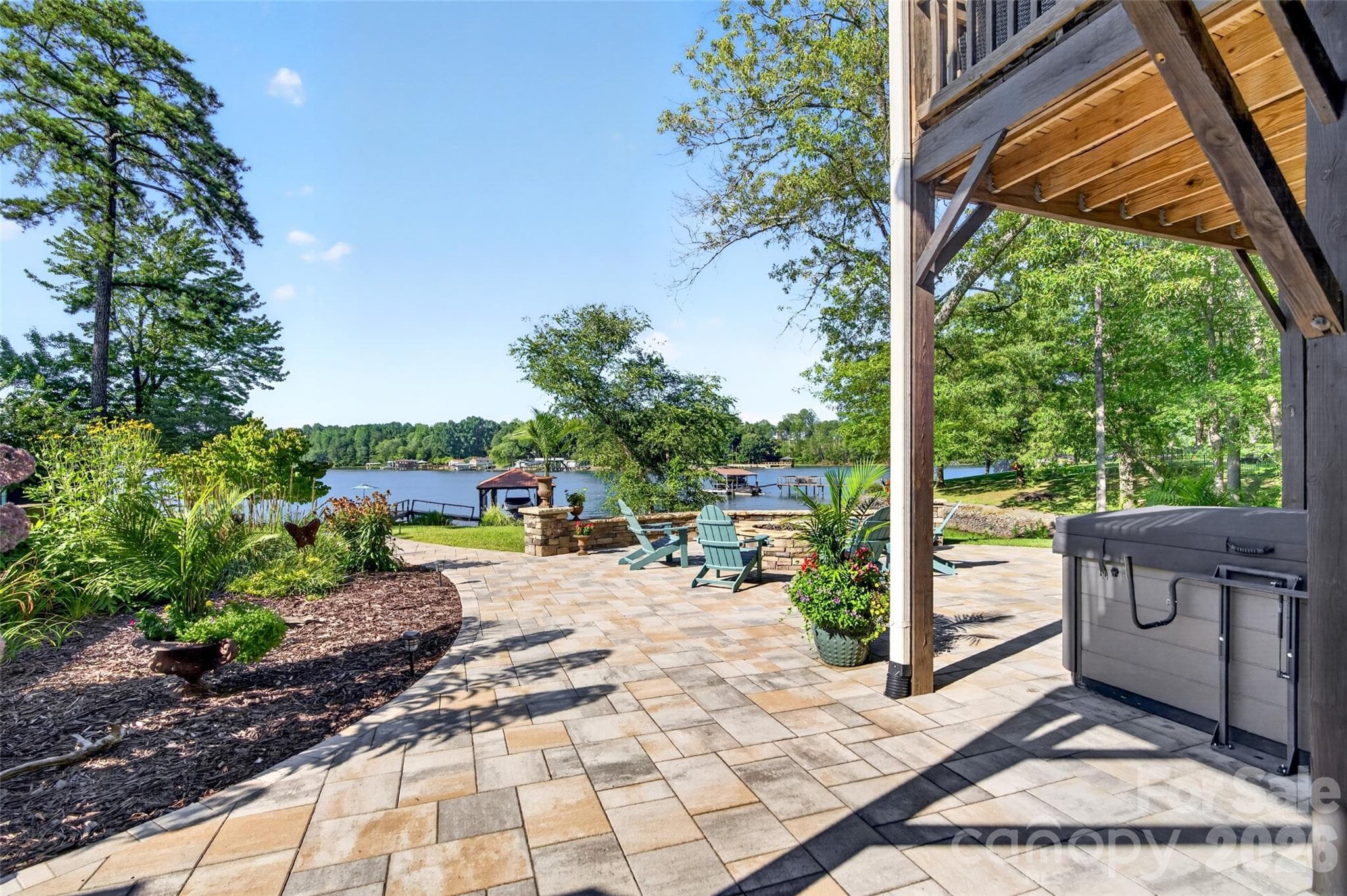Stone Patio Lower Level with Hot Tub and Fire Pit - 7144 Lynbrook Creek Road, Denver