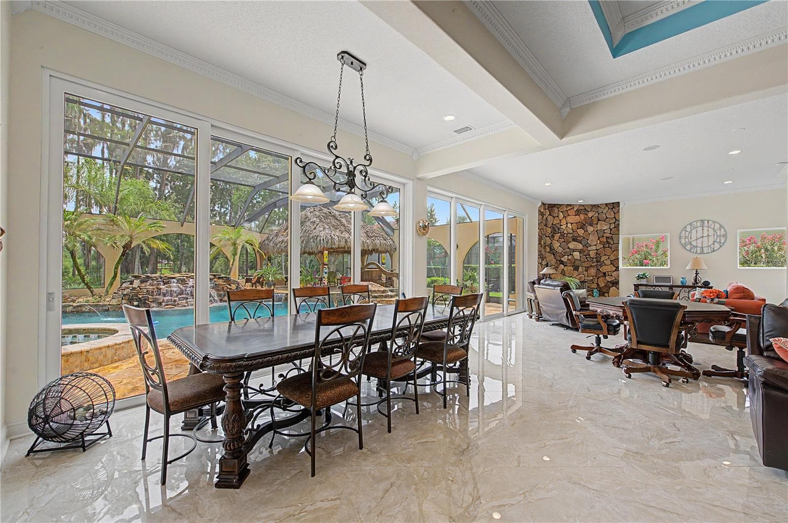 Expansive Family Room with view of Beautiful Pool Oasis, Backyard and Lake - 21246 QUIET HAVEN CT, LAND O LAKES