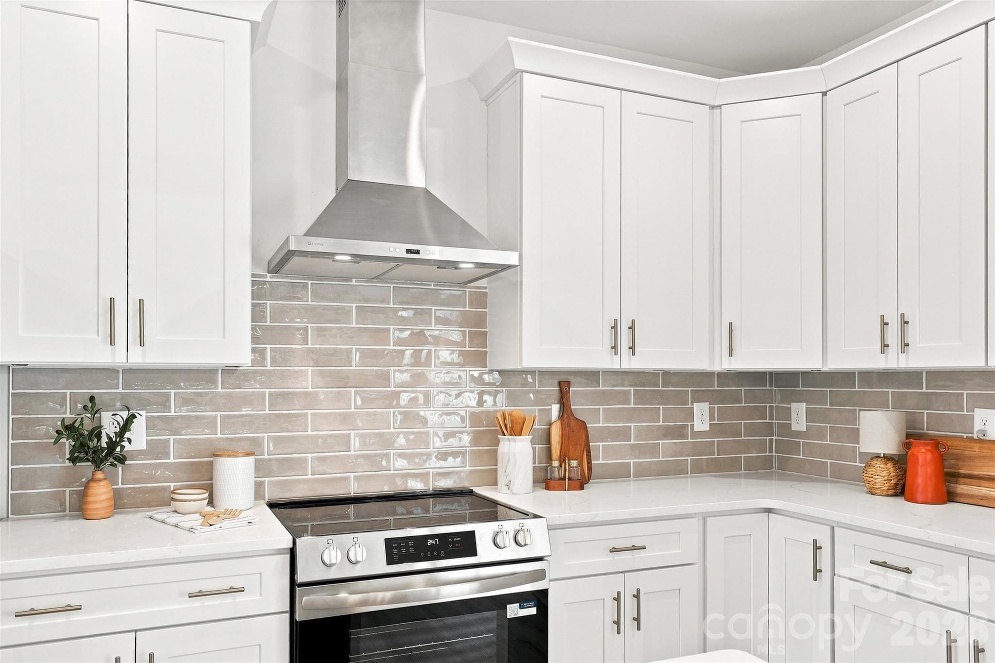 kitchen w/ thoughtfully updated cabinets & countertops, porcelain farmhouse sink, stainless steel hood vent - 390 NC 200 Highway S, Stanfield