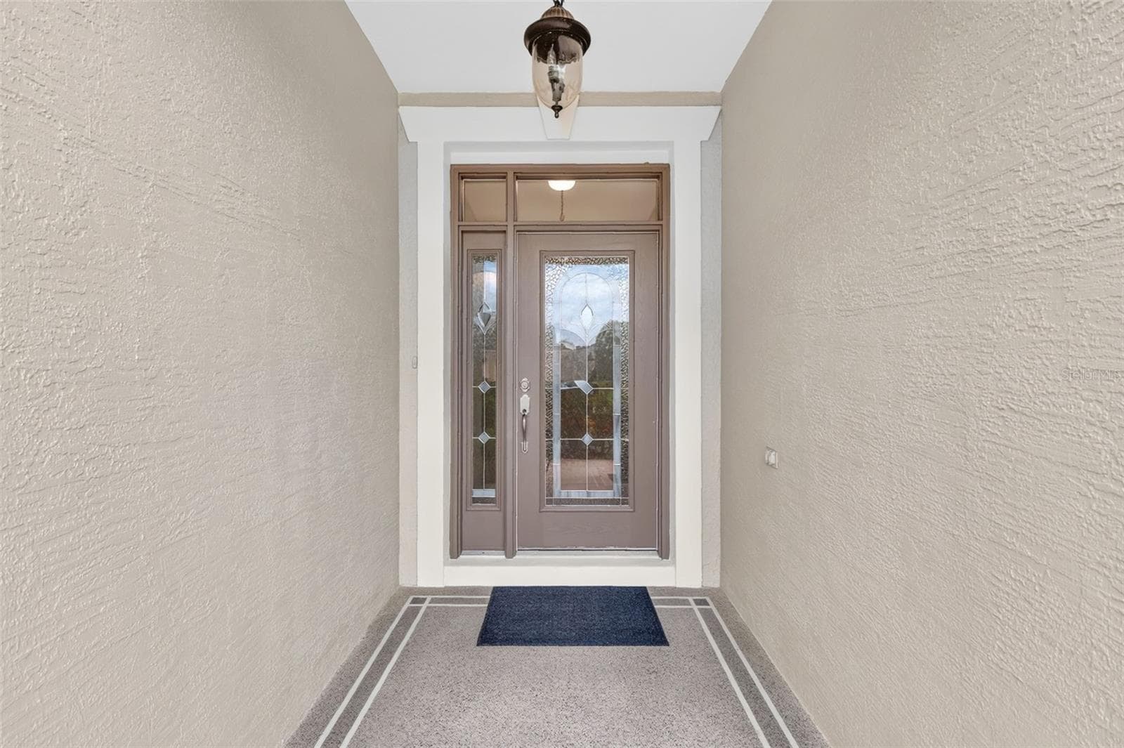 Elegant leaded glass front door with sidelights - 2693 IRIS WAY, THE VILLAGES