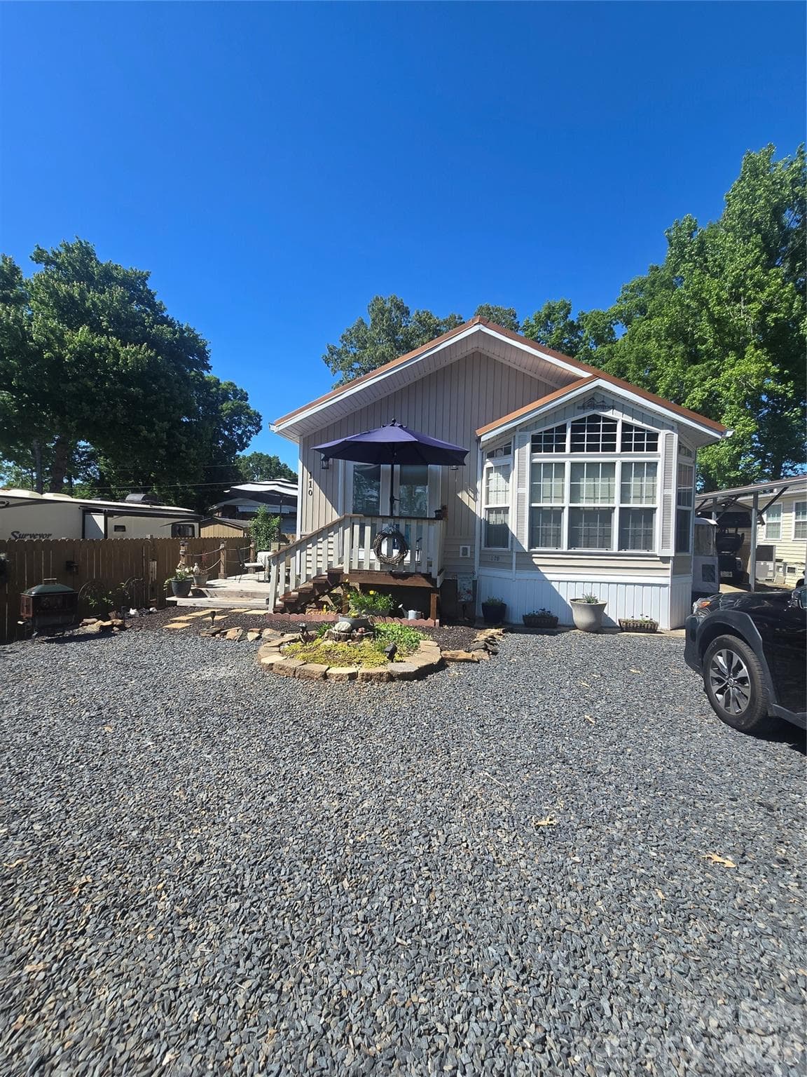 Breckenridge Park Model with a newer addition on left side of house. Space also with deck, for outside enjoyment - 110 Twin Bluff Trail, Mount Gilead