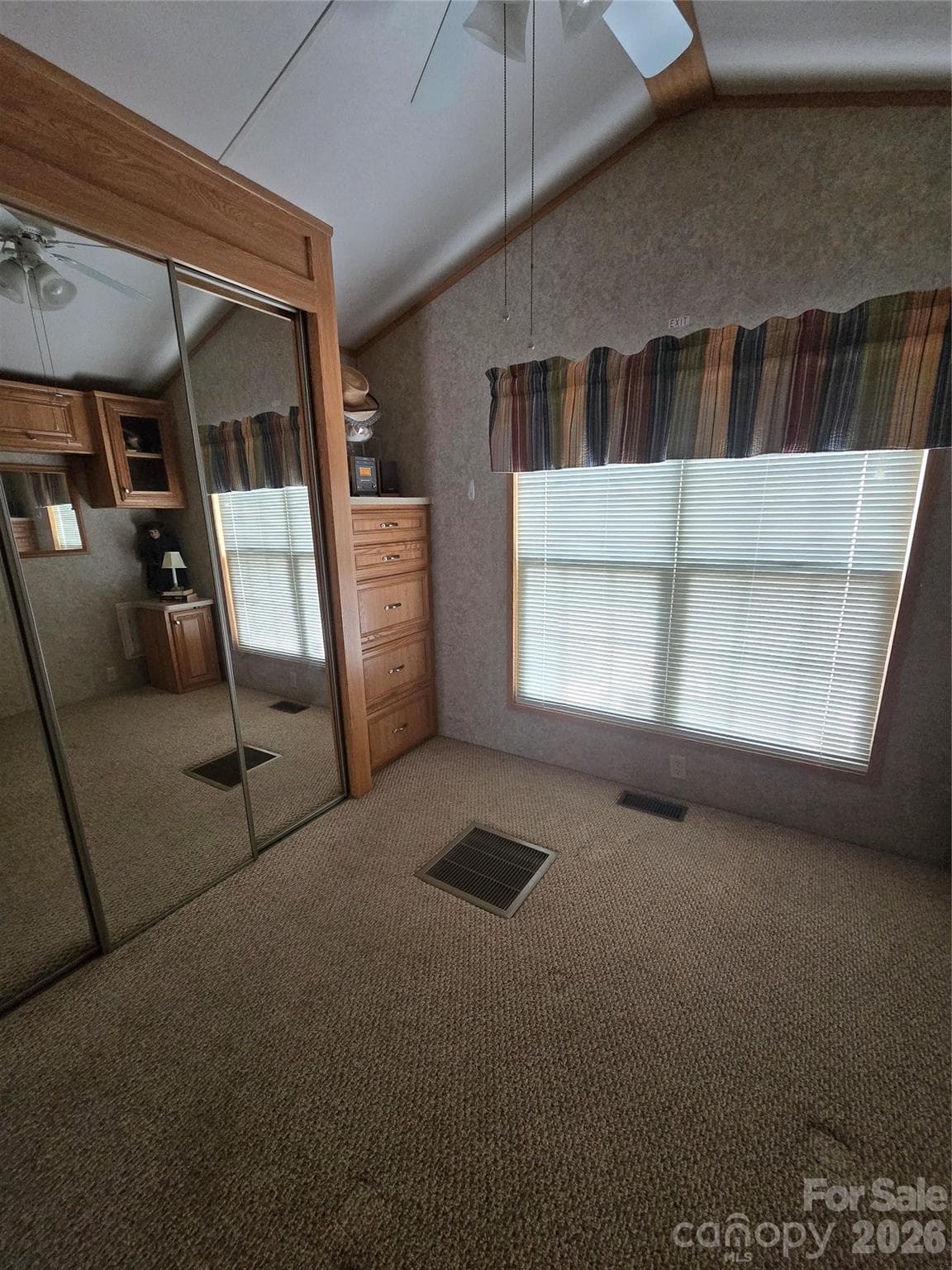 Primary bedroom different angle full closets w mirror doors & built-in chest in corner - 110 Twin Bluff Trail, Mount Gilead