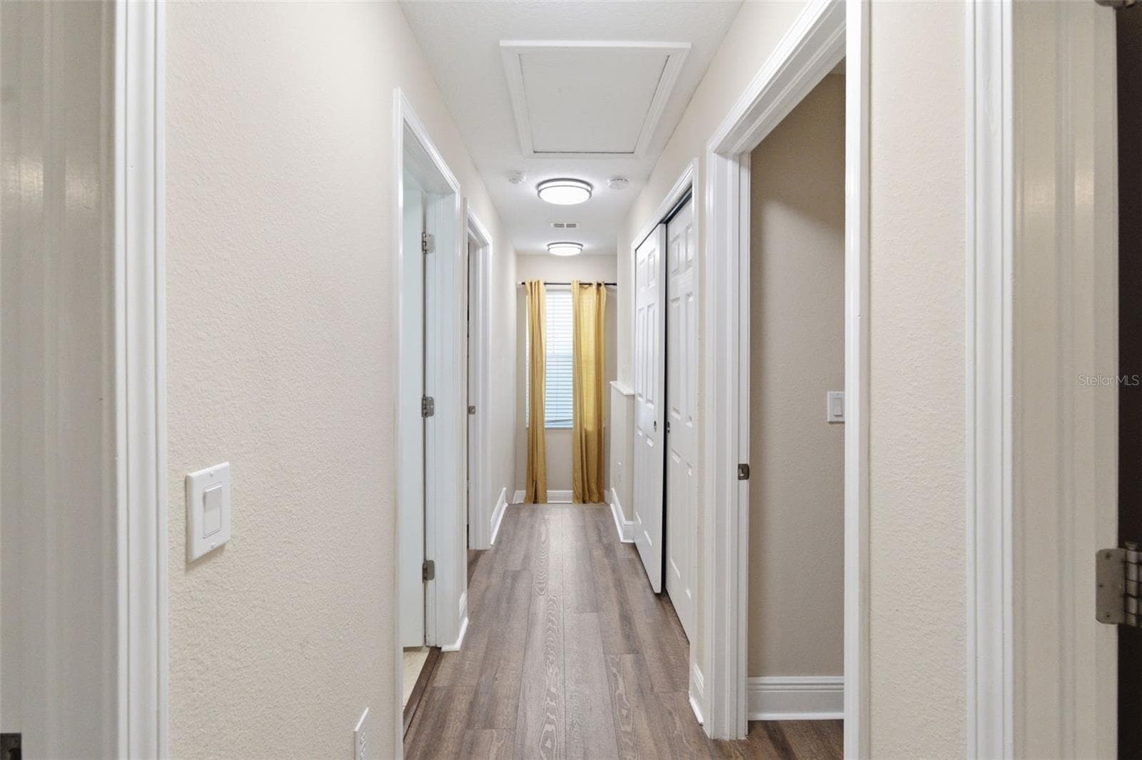 Hallway to 4 bedrooms and 2 bathrooms - 205 E KIRBY ST, TAMPA
