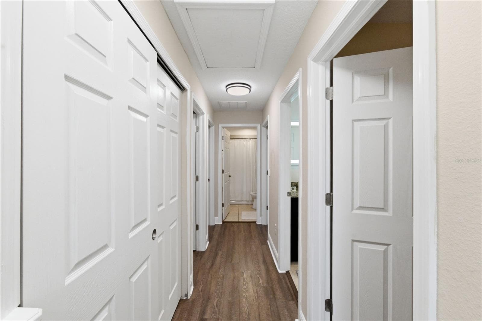 Hallway to 4 bedrooms and 2 bathrooms - 205 E KIRBY ST, TAMPA