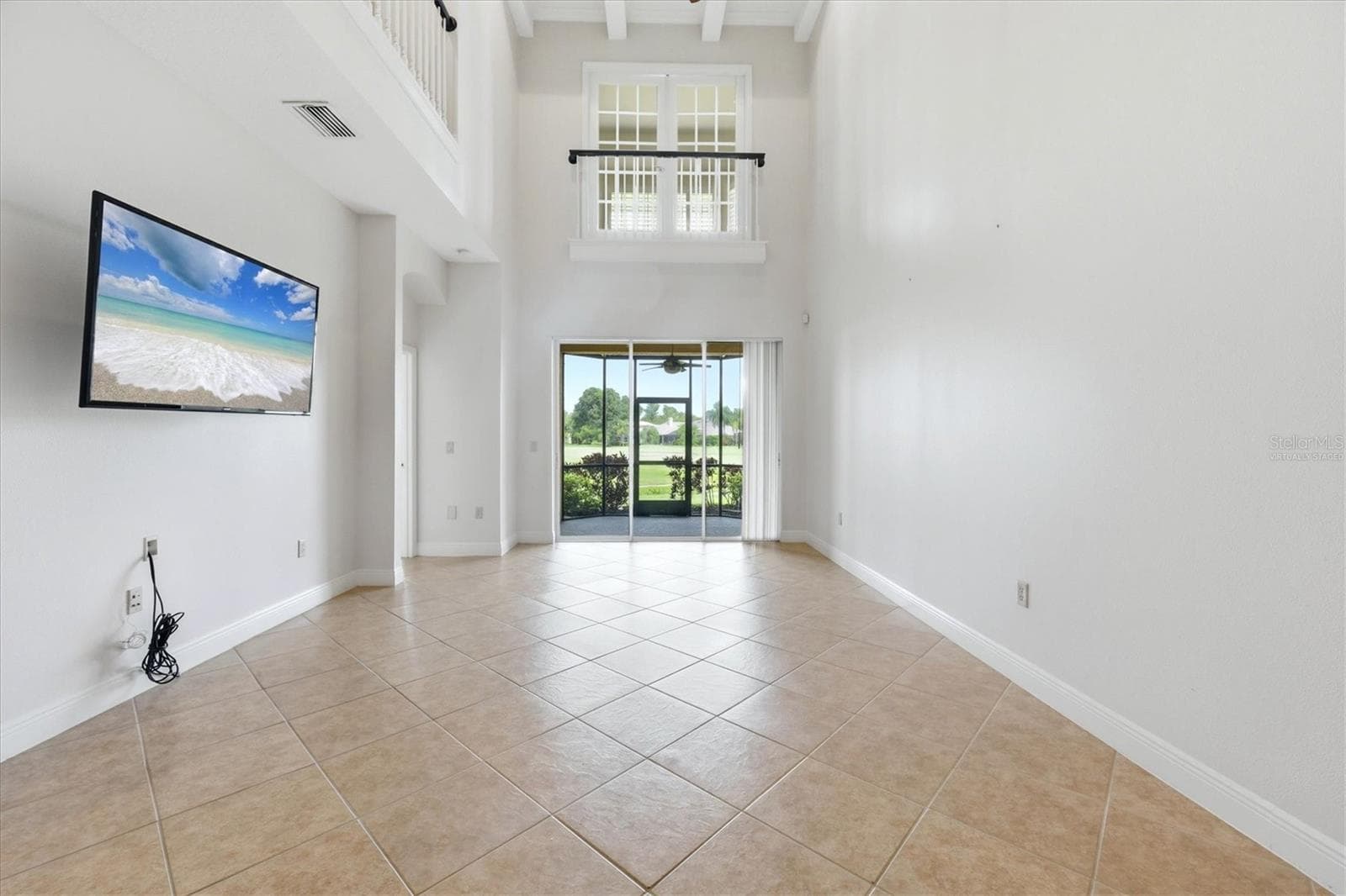 image on tv virtually staged - 8434 MIRAMAR WAY, LAKEWOOD RANCH