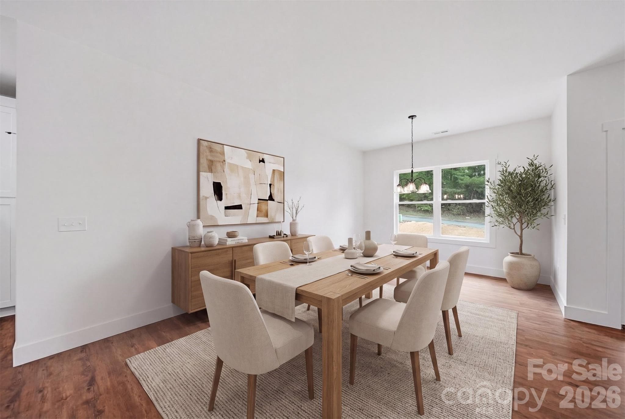 Dining Area is virtually staged. It overlooks the backyard, walking trail and wooded area. - Lenoir