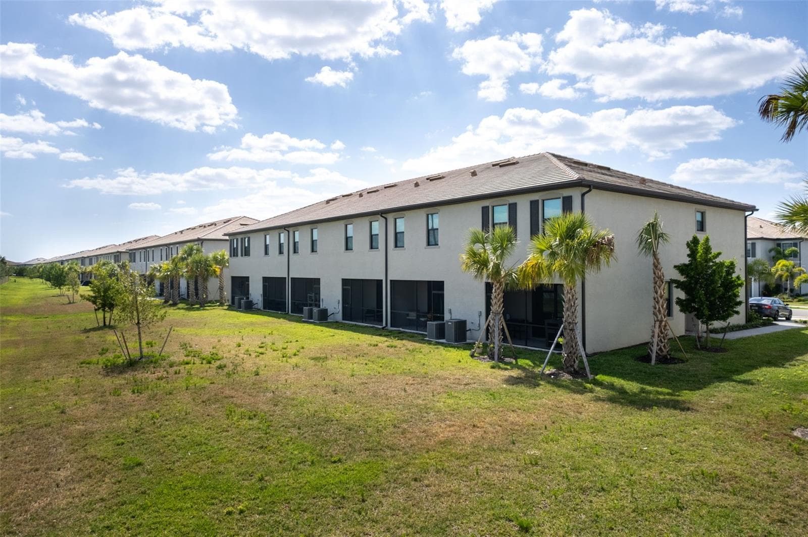 Aerial view showcasing the townhome’s screened lanai :) - 14275 PINE LODGE LN, FORT MYERS