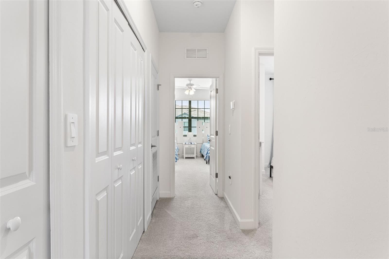 Bright upstairs hallway offering easy access to the bedrooms, bathrooms, and ample closet storage - 14275 PINE LODGE LN, FORT MYERS