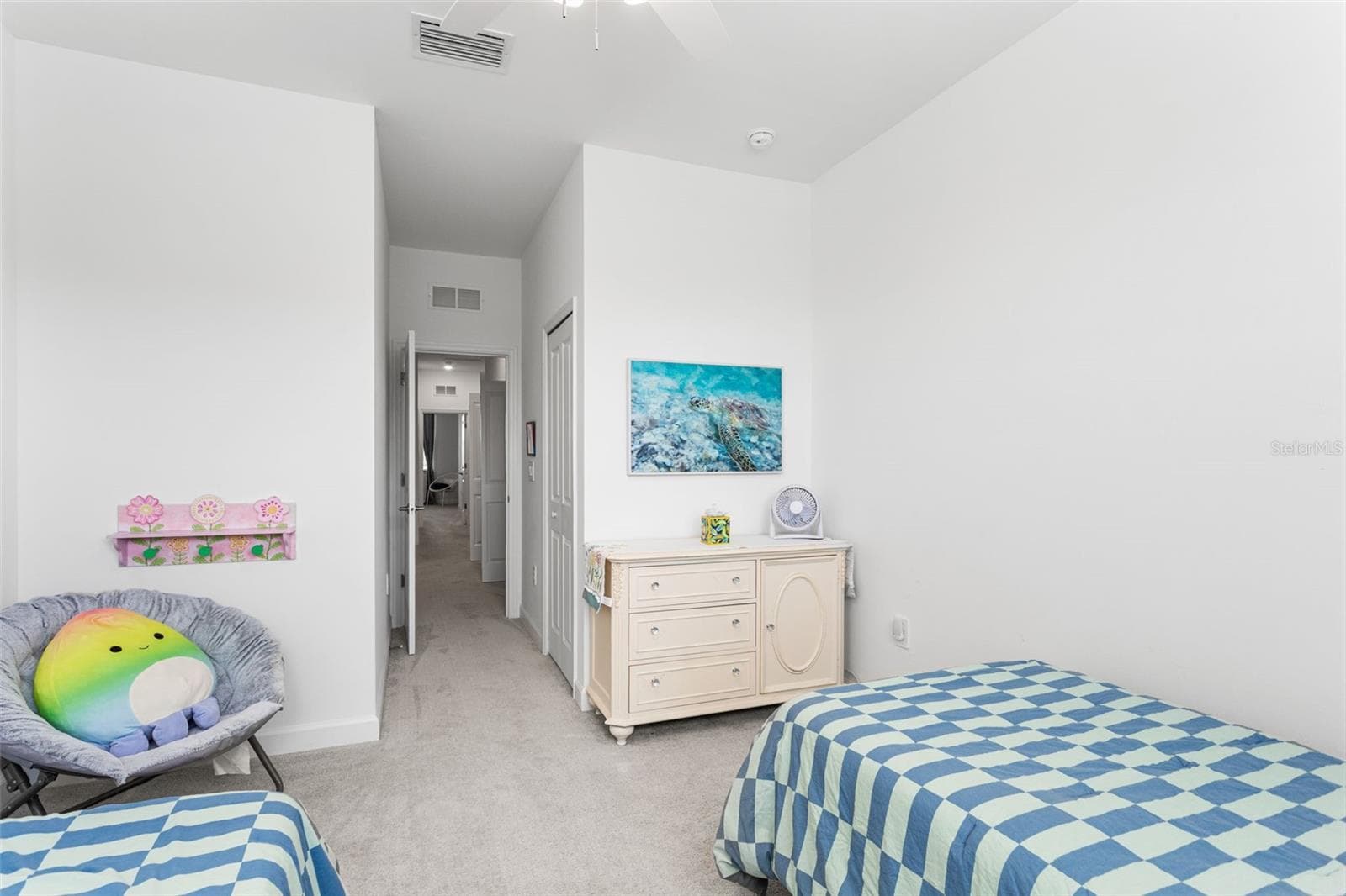 Spacious secondary bedroom with high ceilings, soft carpeting, ceiling fan, and generous closet space - 14275 PINE LODGE LN, FORT MYERS
