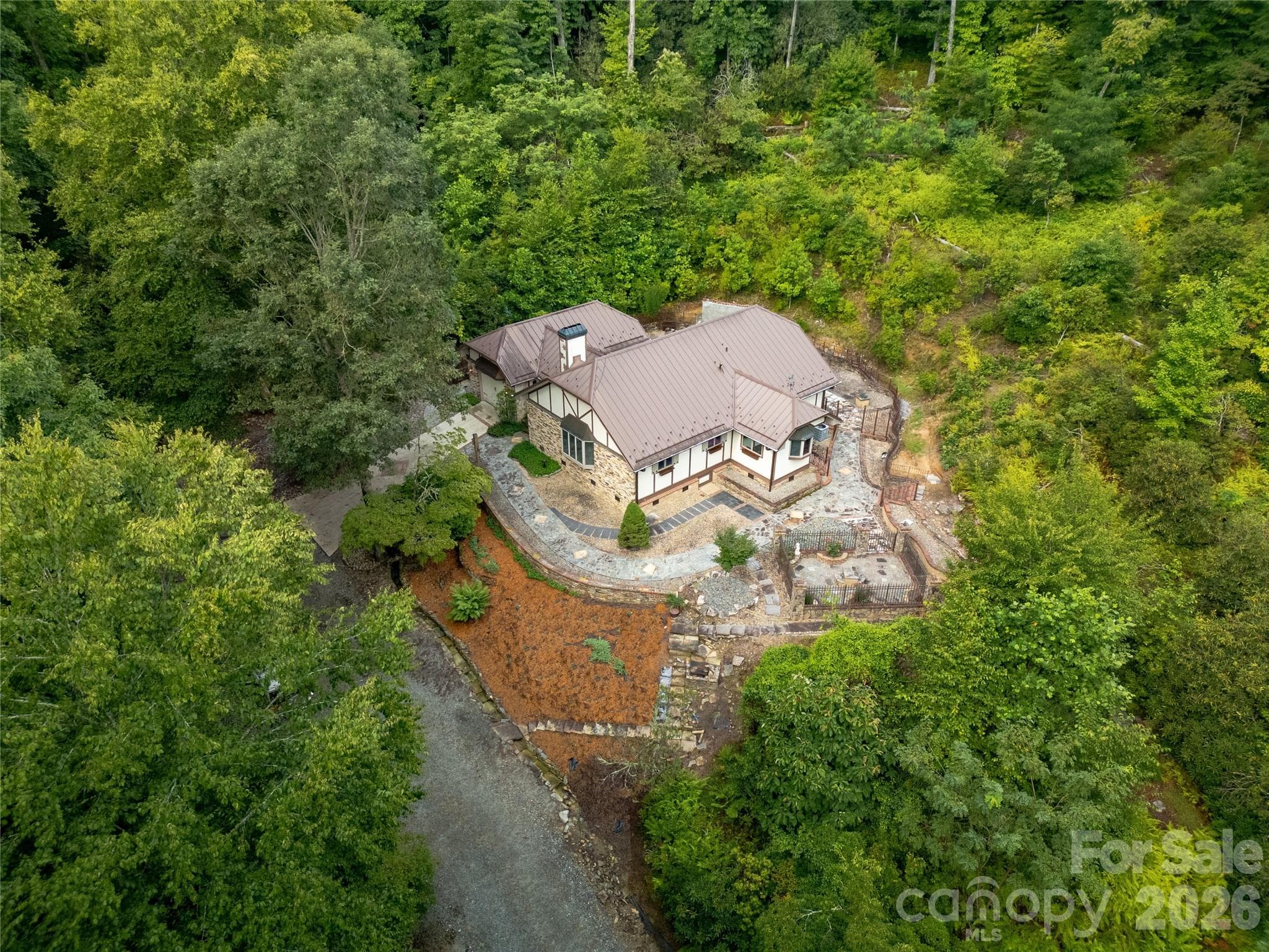 House and Outdoor Setting from the air on the right side. Almost 11 acres of beautiful trees, foliage, and privacy surrounds the house! - 275 Hubbard Hollow Road, Rosman
