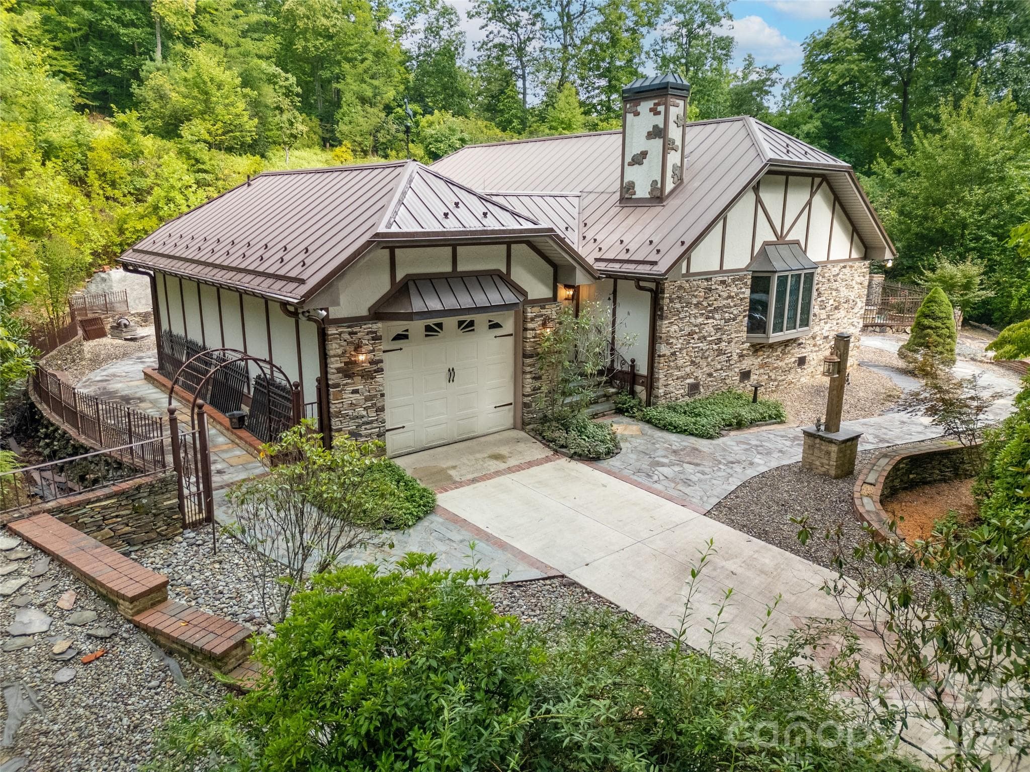 House and Outdoor Setting from the air on the left side. Notice the iron gate and stone walkway to the back on the left.! - 275 Hubbard Hollow Road, Rosman