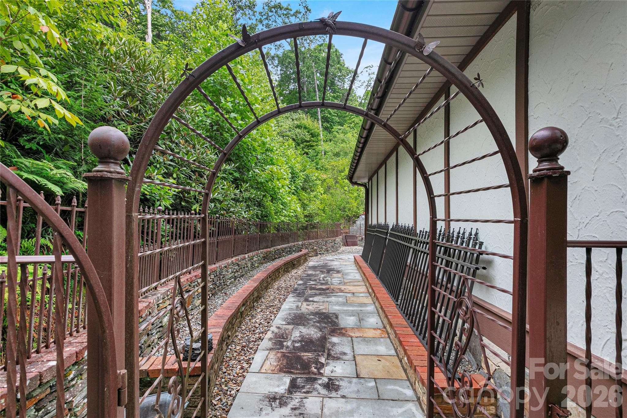 Custom iron entry gate leads to fenced in back yard with stone path and more custom rock work and stone walls! - 275 Hubbard Hollow Road, Rosman