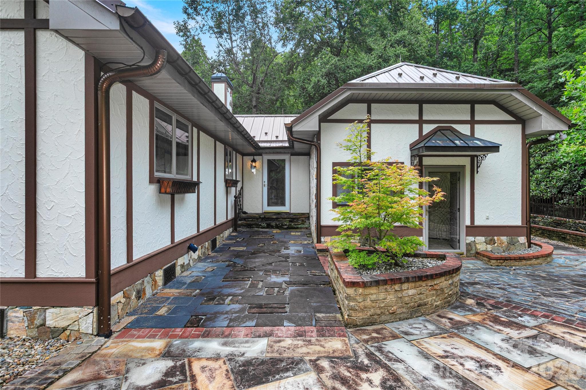 Lots of custom rock work, stone walkways and stone planters! Rear door in middle goes to main entry / foyer! Mud room door on right leads into rear full bath and garage. - 275 Hubbard Hollow Road, Rosman
