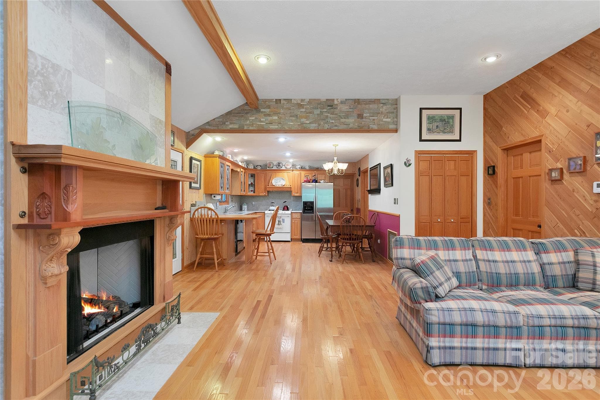 The gas fireplace in the living room is quite regal in appearance and ties it in very nicely with the kitchen and dining area.! - 275 Hubbard Hollow Road, Rosman