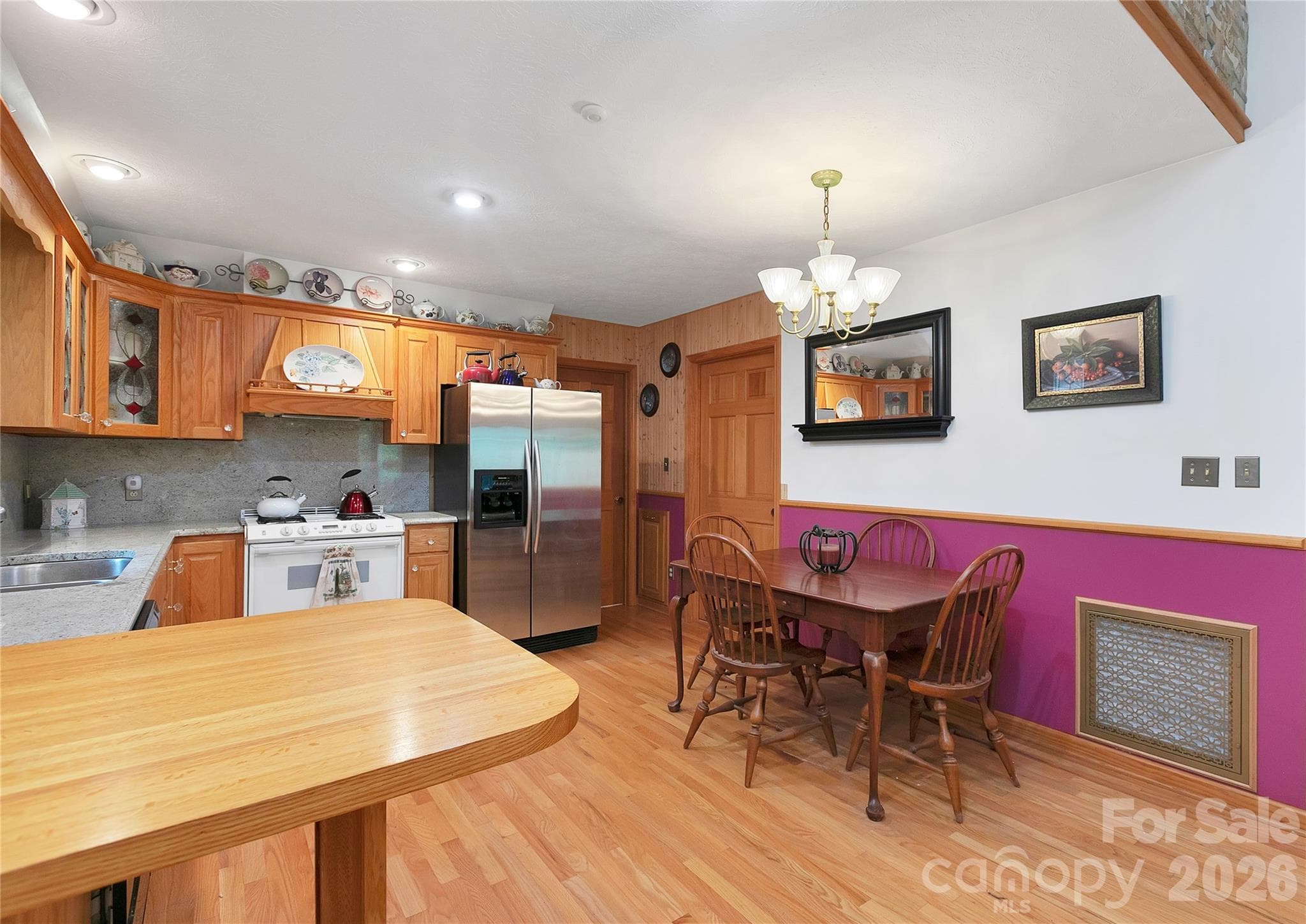The kitchen and dining area are quite nice and very efficient at the same time. The door right behind the dining table goes into a large room for a super pantry.! - 275 Hubbard Hollow Road, Rosman